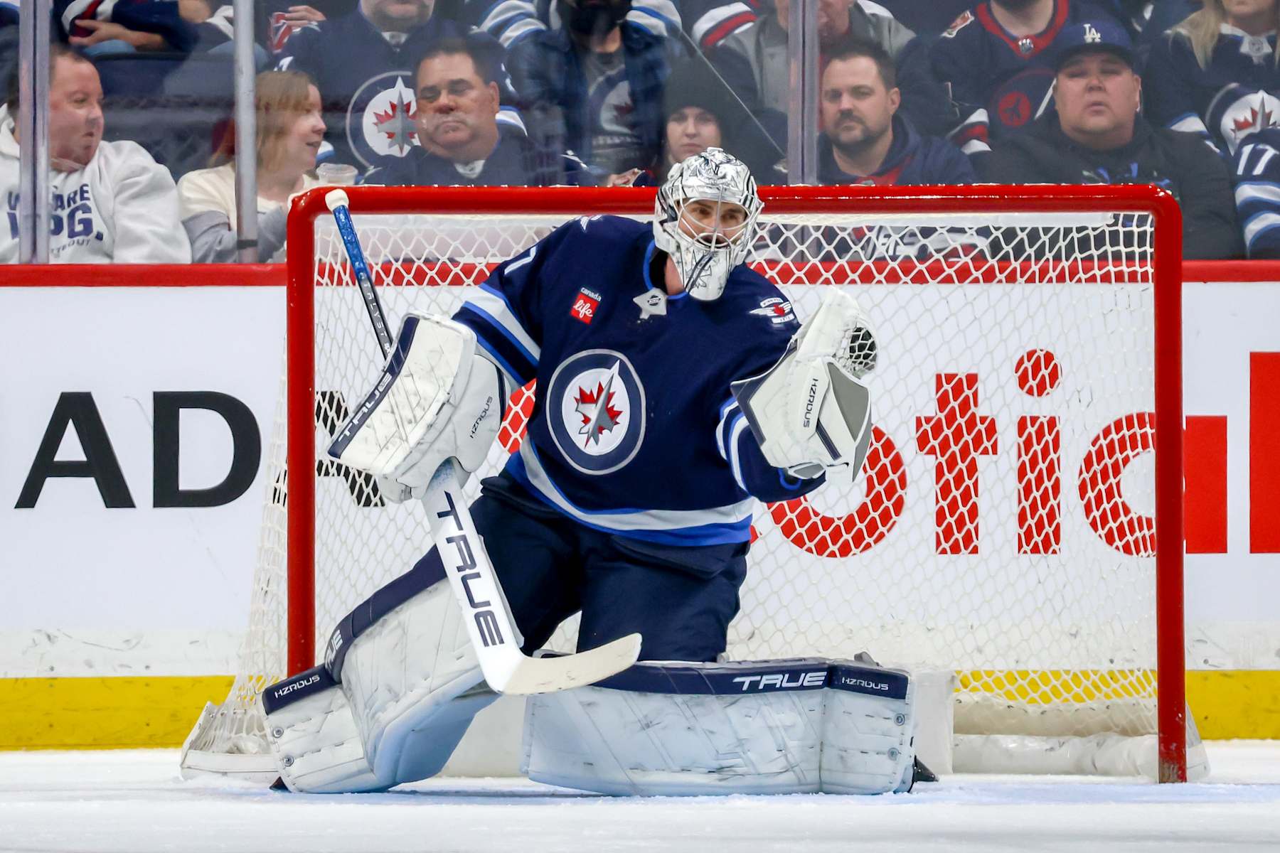 WINNIPEG, CANADA - DECEMBER 28: Goaltender Connor Hellebuyck #37 of the Winnipeg Jets makes a glove save during second period action against the Ottawa Senators at the Canada Life Centre on December 28, 2024 in Winnipeg, Manitoba, Canada. (Photo by Jonathan Kozub/NHLI via Getty Images)