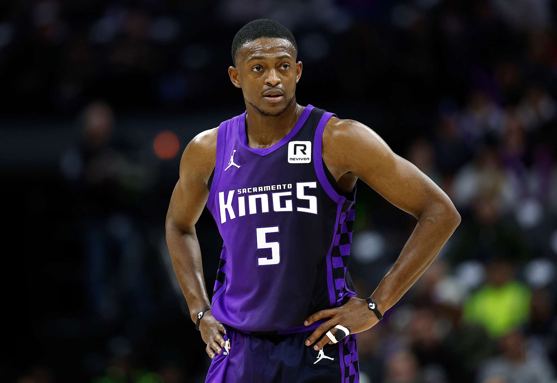 SACRAMENTO, CALIFORNIA - JANUARY 01: De'Aaron Fox #5 of the Sacramento Kings looks on against the Philadelphia 76ers during the first half of an NBA basketball game at Golden 1 Center on January 01, 2025 in Sacramento, California. NOTE TO USER: User expressly acknowledges and agrees that, by downloading and or using this photograph, User is consenting to the terms and conditions of the Getty Images License Agreement. (Photo by Thearon W. Henderson/Getty Images)