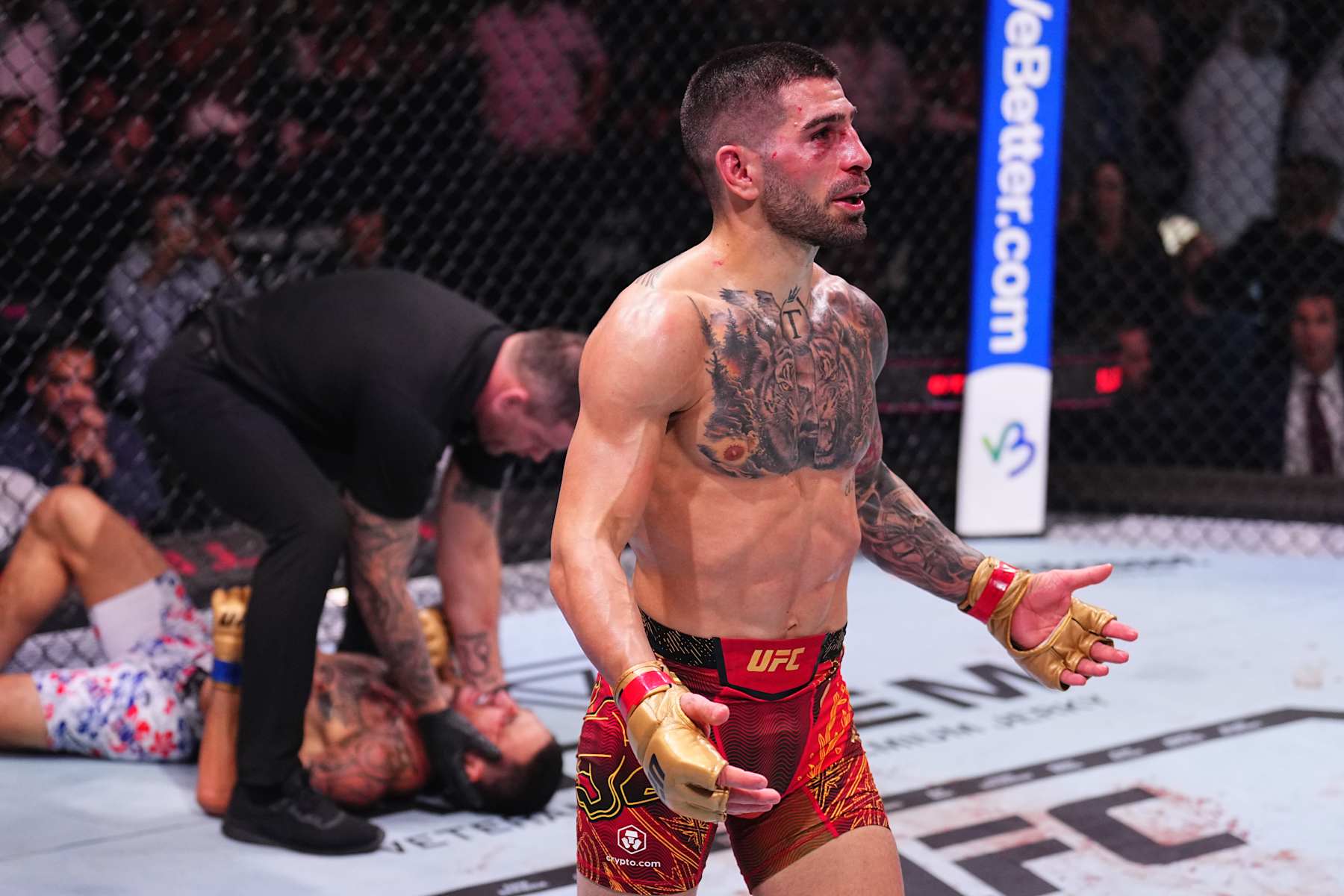 Ilia Topuria reacts after a knockout victory against Max Holloway