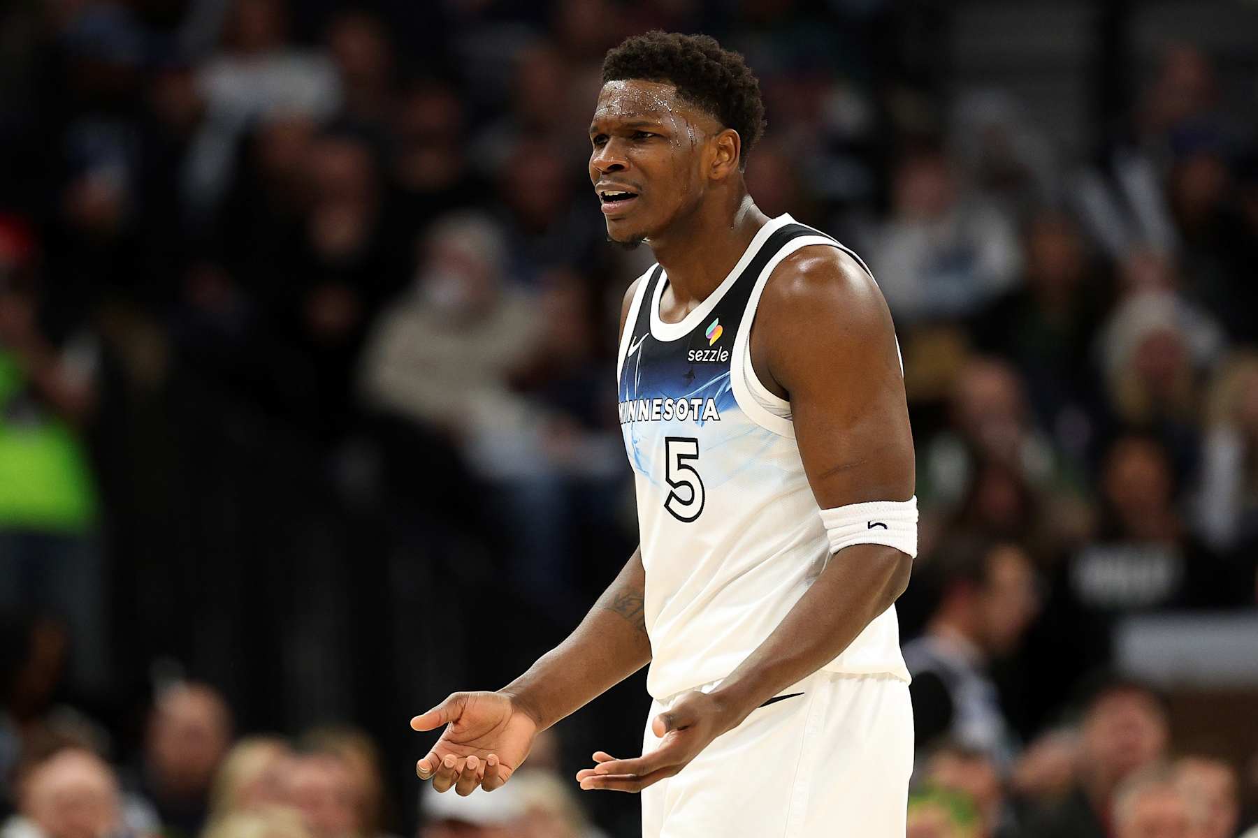 MINNEAPOLIS, MINNESOTA - JANUARY 02: Anthony Edwards #5 of the Minnesota Timberwolves reacts against the Boston Celtics in the first quarter at Target Center on January 02, 2025 in Minneapolis, Minnesota. NOTE TO USER: User expressly acknowledges and agrees that, by downloading and or using this photograph, User is consenting to the terms and conditions of the Getty Images License Agreement. (Photo by David Berding/Getty Images)