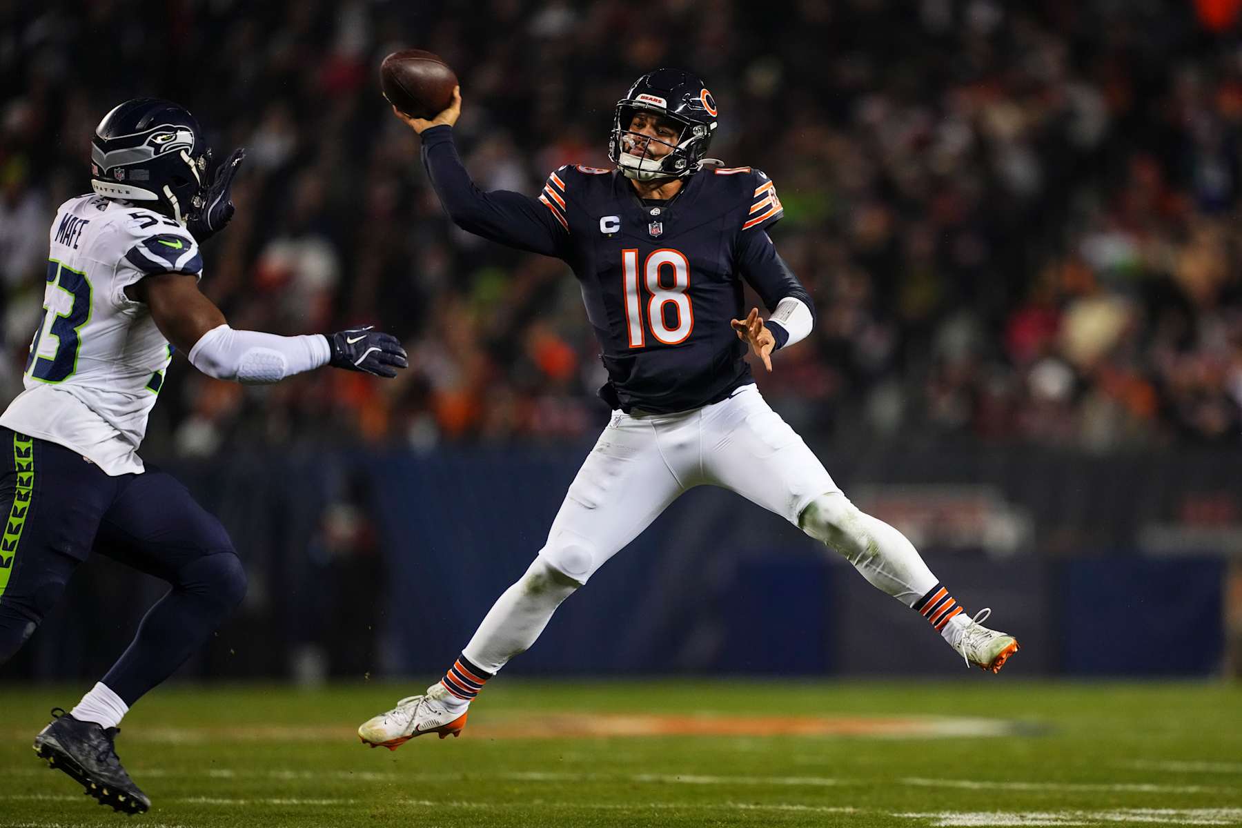 CHICAGO, IL - DECEMBER 26: Caleb Williams #18 of the Chicago Bears throws the ball during an NFL football game against the Seattle Seahawks at Soldier Field on December 26, 2024 in Chicago, Illinois. (Photo by Cooper Neill/Getty Images)