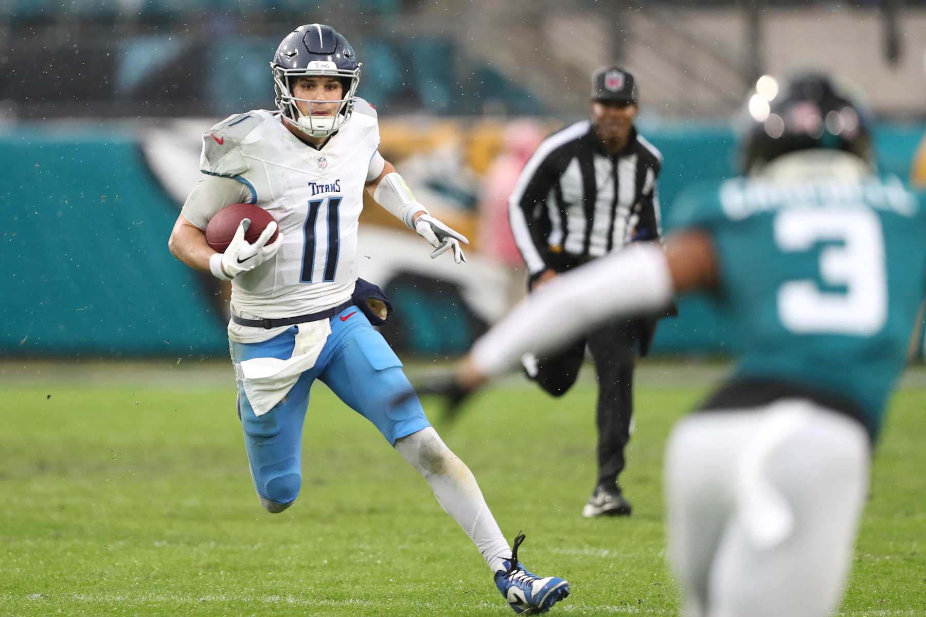 JACKSONVILLE, FLORIDA - DECEMBER 29: Mason Rudolph #11 of the Tennessee Titans runs for yardage during the first half against the Jacksonville Jaguars at EverBank Stadium on December 29, 2024 in Jacksonville, Florida. (Photo by Courtney Culbreath/Getty Images)