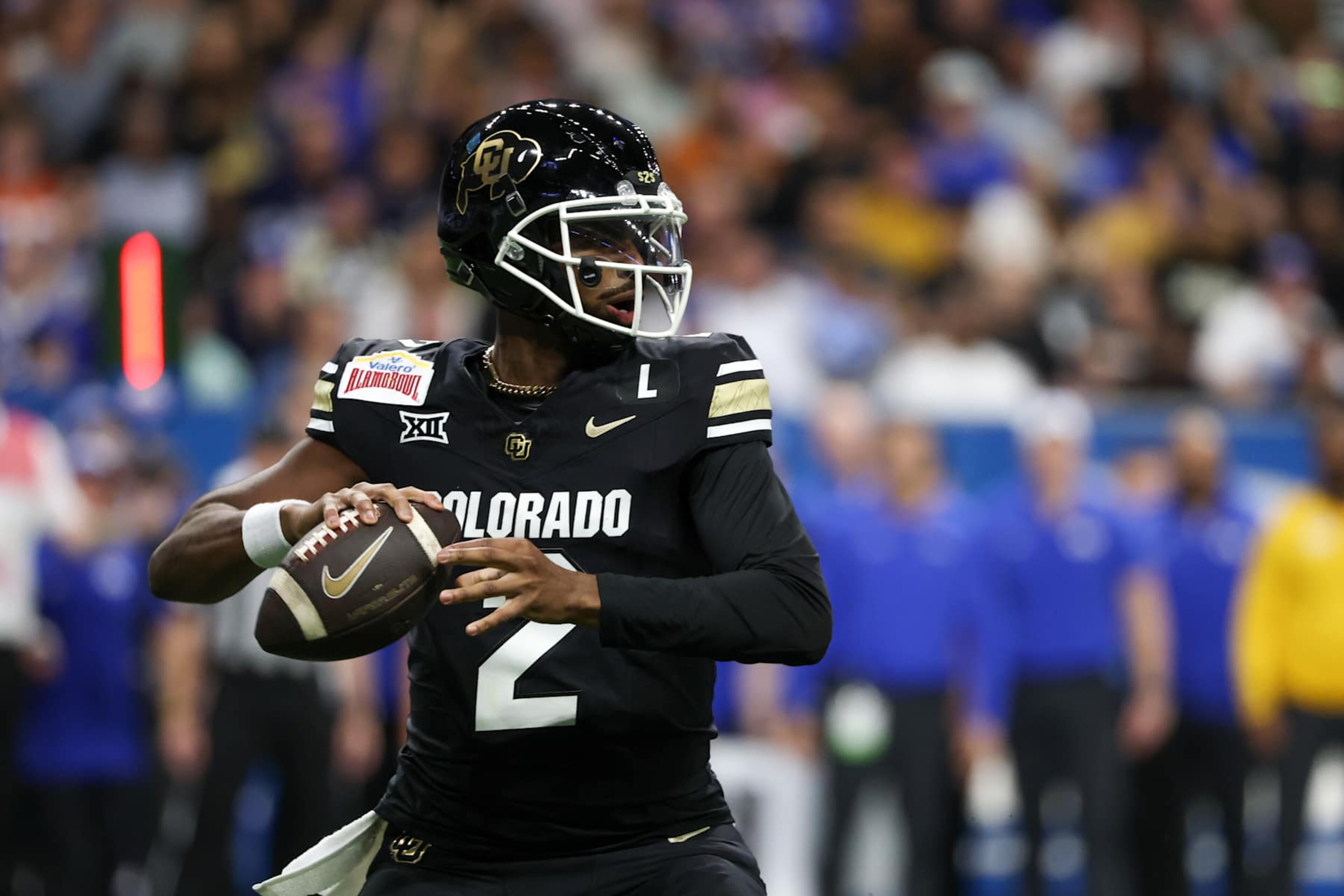 SAN ANTONIO, TX - DECEMBER 28: Colorado Buffaloes quarterback Shedeur Sanders (2) readies to pass the ball during the football game between BYU Cougars and Colorado Buffalos on December 28, 2024, at the Alamodome in San Antonio, Texas. (Photo by David Buono/Icon Sportswire via Getty Images) SAN ANTONIO, TX - DECEMBER 28: Colorado Buffaloes quarterback Shedeur Sanders (2) readies to pass the ball during the football game between BYU Cougars and Colorado Buffalos on December 28, 2024, at the Alamodome in San Antonio, Texas. (Photo by David Buono/Icon Sportswire via Getty Images)