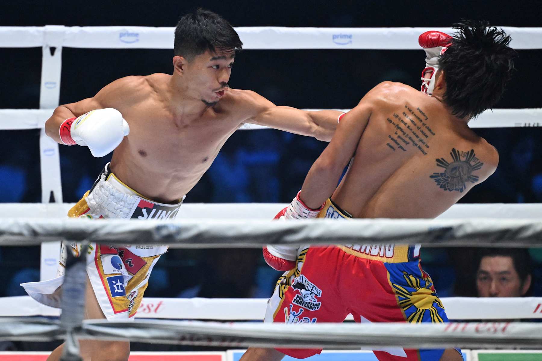 Japan's Junto Nakatani (L) fights against Philippines' Vincent Astrolabio during their WBC bantamweight title boxing match at Ryogoku Kokugikan in Tokyo on July 20, 2024. (Photo by Yuichi YAMAZAKI / AFP) (Photo by YUICHI YAMAZAKI/AFP via Getty Images)