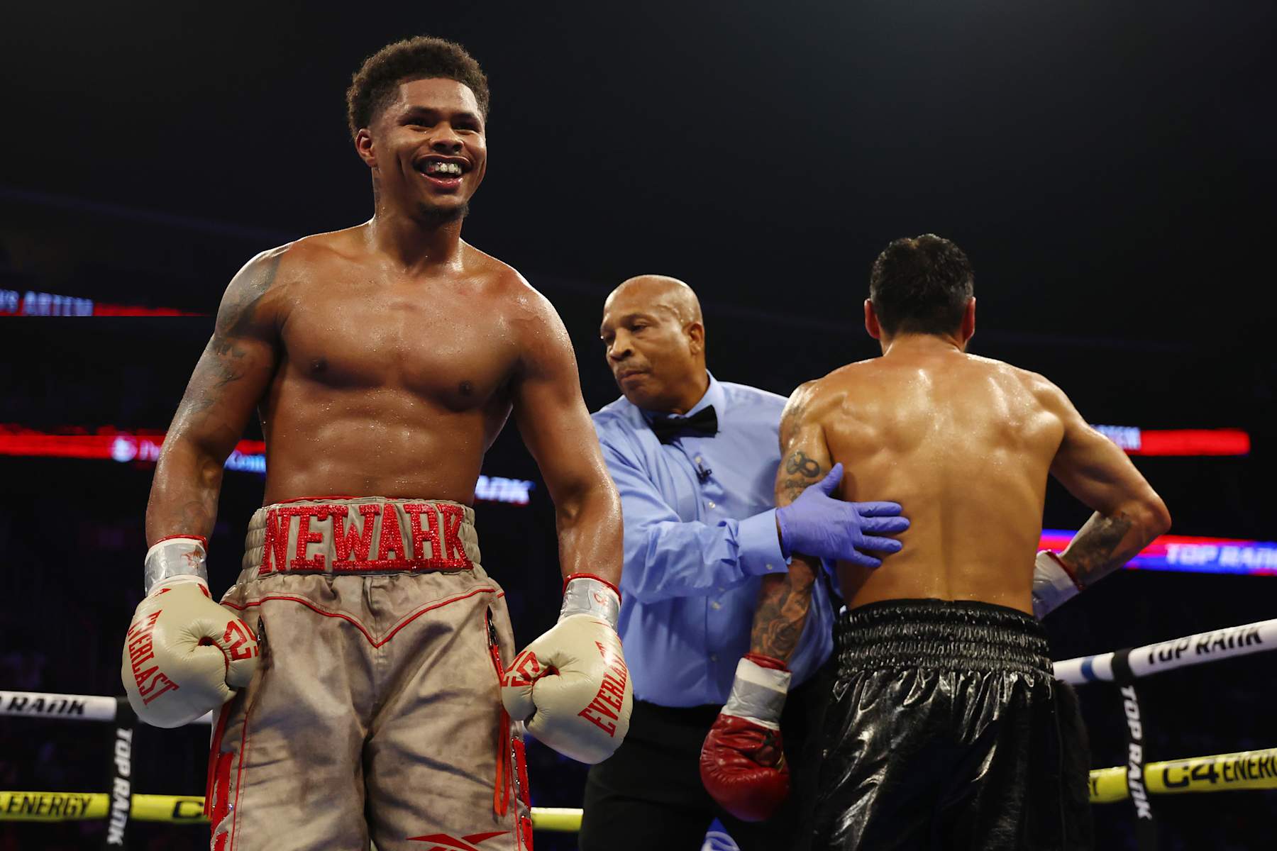NEWARK, NEW JERSEY - JULY 06: Shakur Stevenson (gold gloves) reacts against Artem Harutyunyan of Germany (red gloves) during their WBC Lightweight World Title fight at Prudential Center on July 06, 2024 in Newark, New Jersey. (Photo by Sarah Stier/Getty Images)
