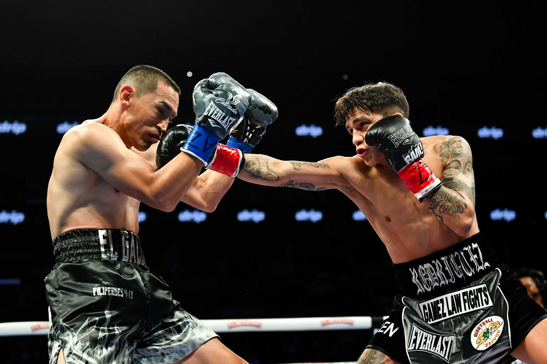 PHOENIX, ARIZONA - JUNE 29: Jesse ‘Bam’ Rodriguez (R) of the United States throws a right on Juan Francisco Estrada (L) of Mexico during their WBC world and Ring Magazine super flyweight title bout at Footprint Center on June 29, 2024 in Phoenix, Arizona. (Photo by Kelsey Grant/Getty Images)