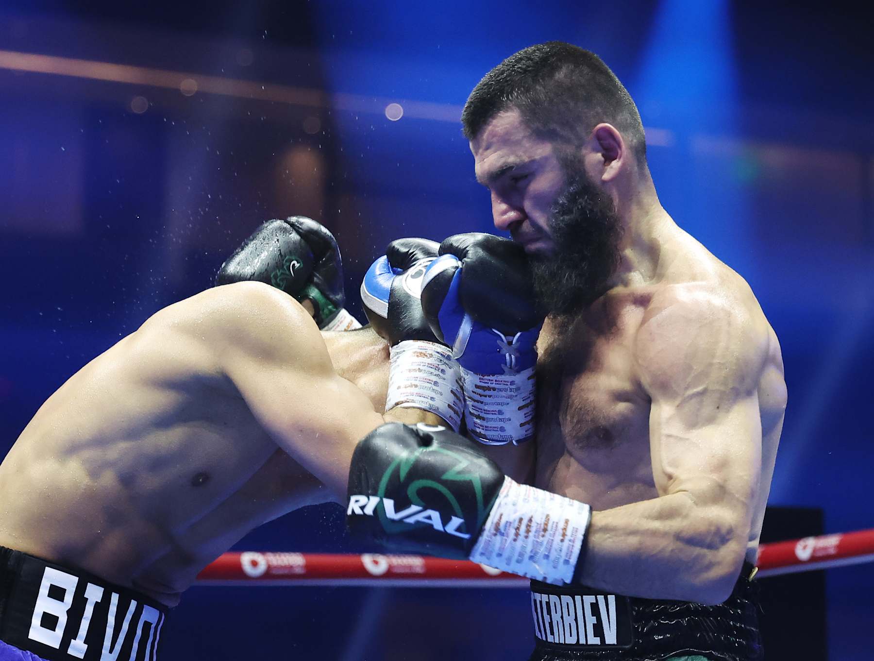 RIYADH, SAUDI ARABIA - OCTOBER 12: Artur Beterbiev punches Dmitrii Bivol during the IBF, IBO, WBC and WBO World Light Heavyweight titles' fight between Artur Beterbiev and Dmitrii Bivol as part of the Riyadh Season - IV Crown Showdown card at Kingdom Arena on October 12, 2024 in Riyadh. (Photo by Richard Pelham/Getty Images)