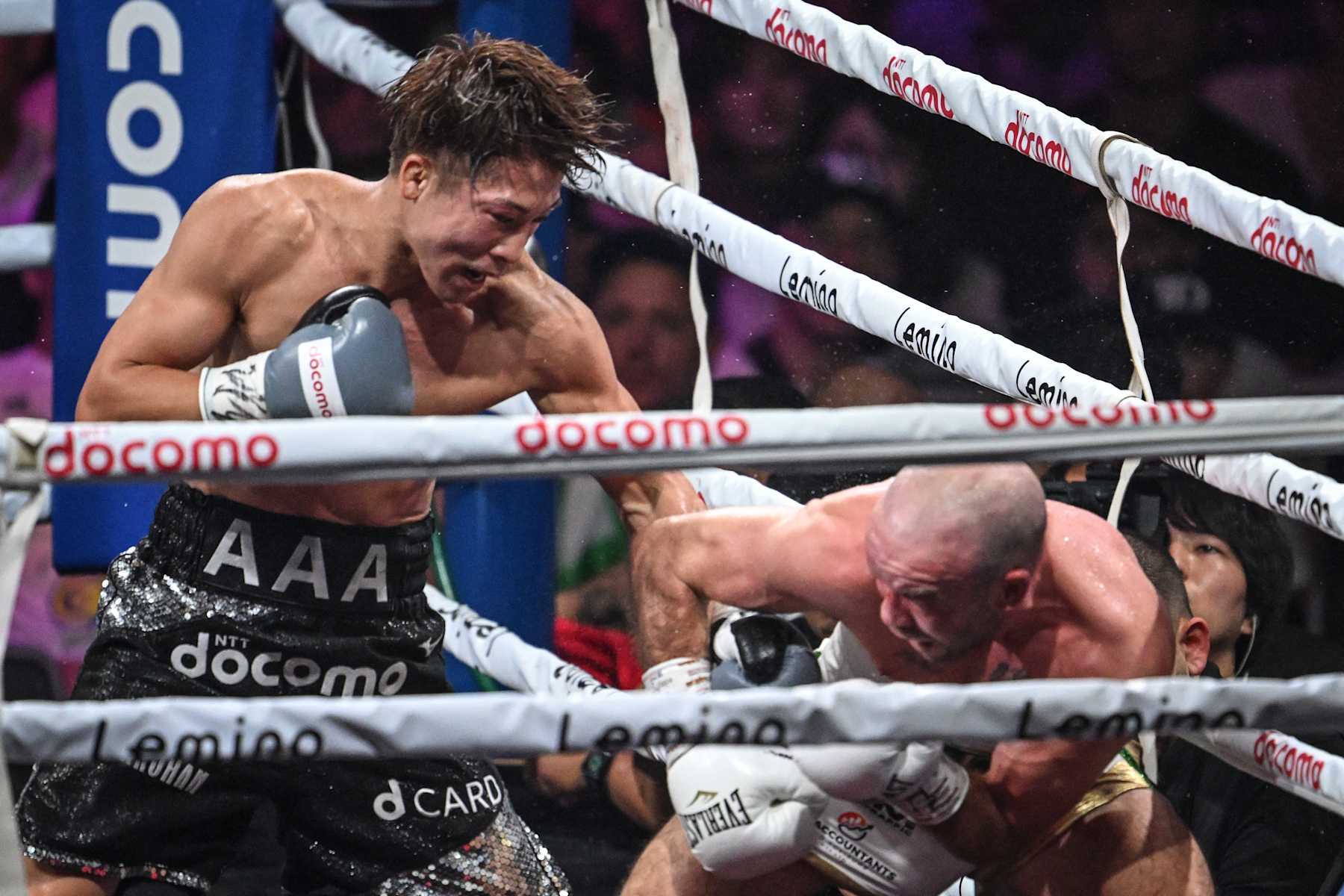 Japan's Naoya Inoue (L) and Ireland's TJ Doheny fight during their IBF-WBA-WBC-WBO super-bantamweight title boxing match at at Ariake Arena in Tokyo on September 3, 2024. (Photo by Yuichi YAMAZAKI / AFP) (Photo by YUICHI YAMAZAKI/AFP via Getty Images)