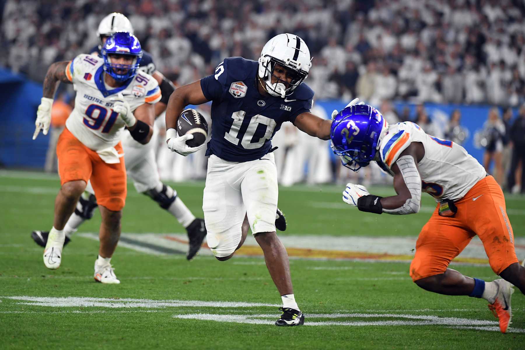 GLENDALE, ARIZONA - DECEMBER 31: Nicholas Singleton #10 of the Penn State Nittany Lions fights off a tackle attempt during the second half against the Boise State Broncos in the Fiesta Bowl at State Farm Stadium on December 31, 2024 in Glendale, Arizona. (Photo by CFP/Getty Images)