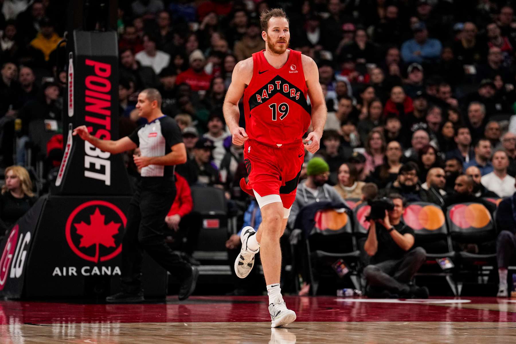 TORONTO, ON - DECEMBER 1: Jakob Poeltl #19 of the Toronto Raptors runs up the court against the Miami Heat at Scotiabank Arena on December 1, 2024 in Toronto, Ontario, Canada. NOTE TO USER: User expressly acknowledges and agrees that, by downloading and/or using this Photograph, user is consenting to the terms and conditions of the Getty Images License Agreement. (Photo by Andrew Lahodynskyj/Getty Images)