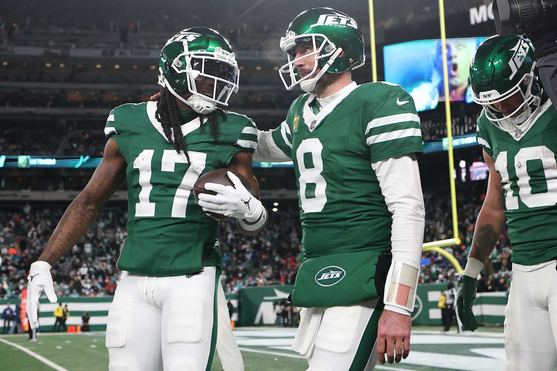 EAST RUTHERFORD, NEW JERSEY - JANUARY 05: Davante Adams #17 of the New York Jets celebrates after scoring a touchdown with teammate Aaron Rodgers #8 during the fourth quarter against the Miami Dolphins at MetLife Stadium on January 05, 2025 in East Rutherford, New Jersey. (Photo by Luke Hales/Getty Images)