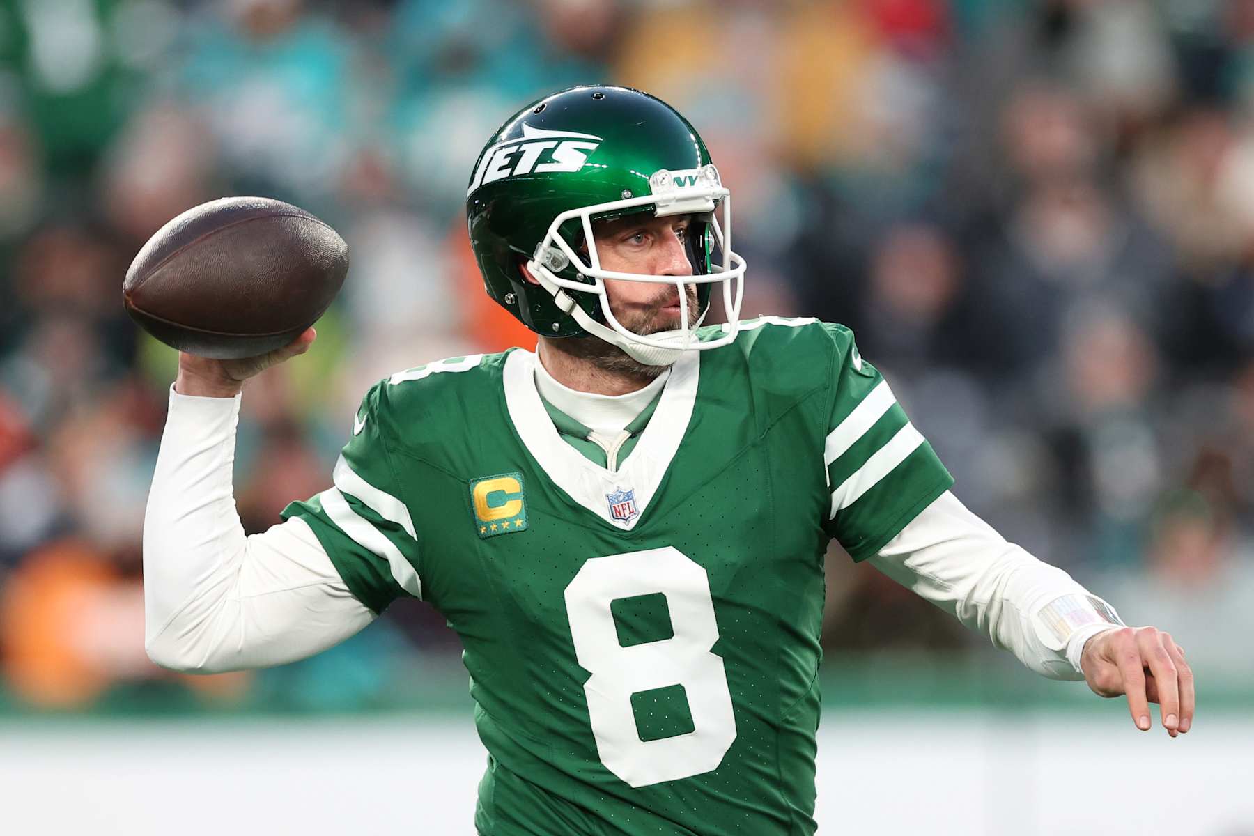 EAST RUTHERFORD, NEW JERSEY - JANUARY 05: Aaron Rodgers #8 of the New York Jets throws a pass against the Miami Dolphins in the first quarter at MetLife Stadium on January 05, 2025 in East Rutherford, New Jersey. (Photo by Luke Hales/Getty Images)