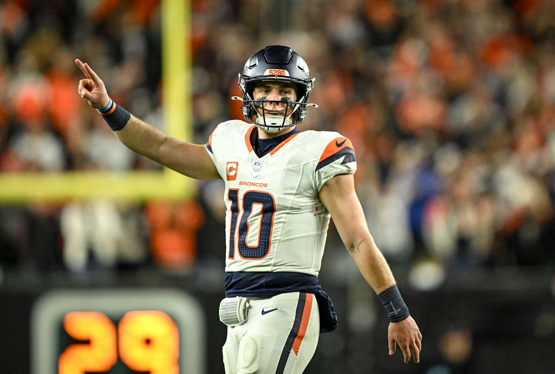 CINCINNATI, OH - DECEMBER 28: Bo Nix (10) of the Denver Broncos calls for a two-poiont conversion after hitting Marvin Mims Jr. (19) for a touchdown reception making the score 24-23 before an extra point during the fourth quarter of the Bengals' 30-24 win at Paycor Stadium in Cincinnati, Ohio on Saturday, December 28, 2024. (Photo by AAron Ontiveroz/The Denver Post)