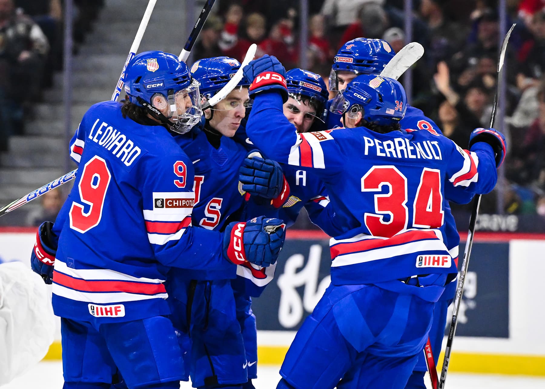 OTTAWA, CANADA - JANUARY 05: Cole Hutson #24 of Team USA celebrates his goal with teammates Ryan Leonard #9, Brandon Svoboda #8, Zeev Buium #28 and Gabe Perreault #34 in the second period against Team Finland of the gold medal game during the 2025 IIHF World Junior Championship at Canadian Tire Centre on January 5, 2025 in Ottawa, Ontario, Canada. (Photo by Minas Panagiotakis/Getty Images)