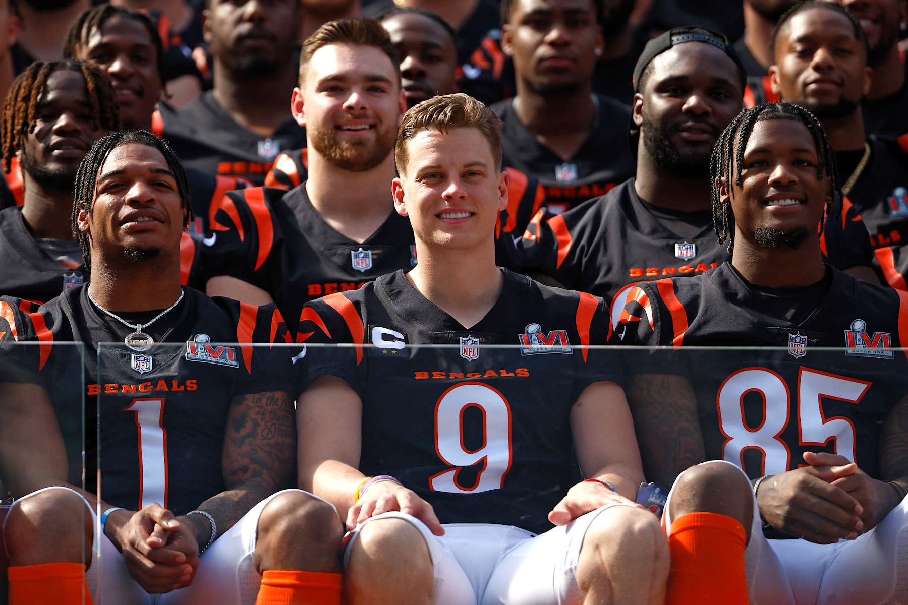 LOS ANGELES, CALIFORNIA - FEBRUARY 12: L-R Ja'Marr Chase #1, Joe Burrow #9 and Tee Higgins #85 of the Cincinnati Bengals sit in the front for the Cincinnati Bengals team photo at UCLA's Drake Stadium on February 12, 2022 in Los Angeles, California. The Bengals will play against the Los Angeles Rams in Super Bowl LVI on February 13. (Photo by Ronald Martinez/Getty Images)