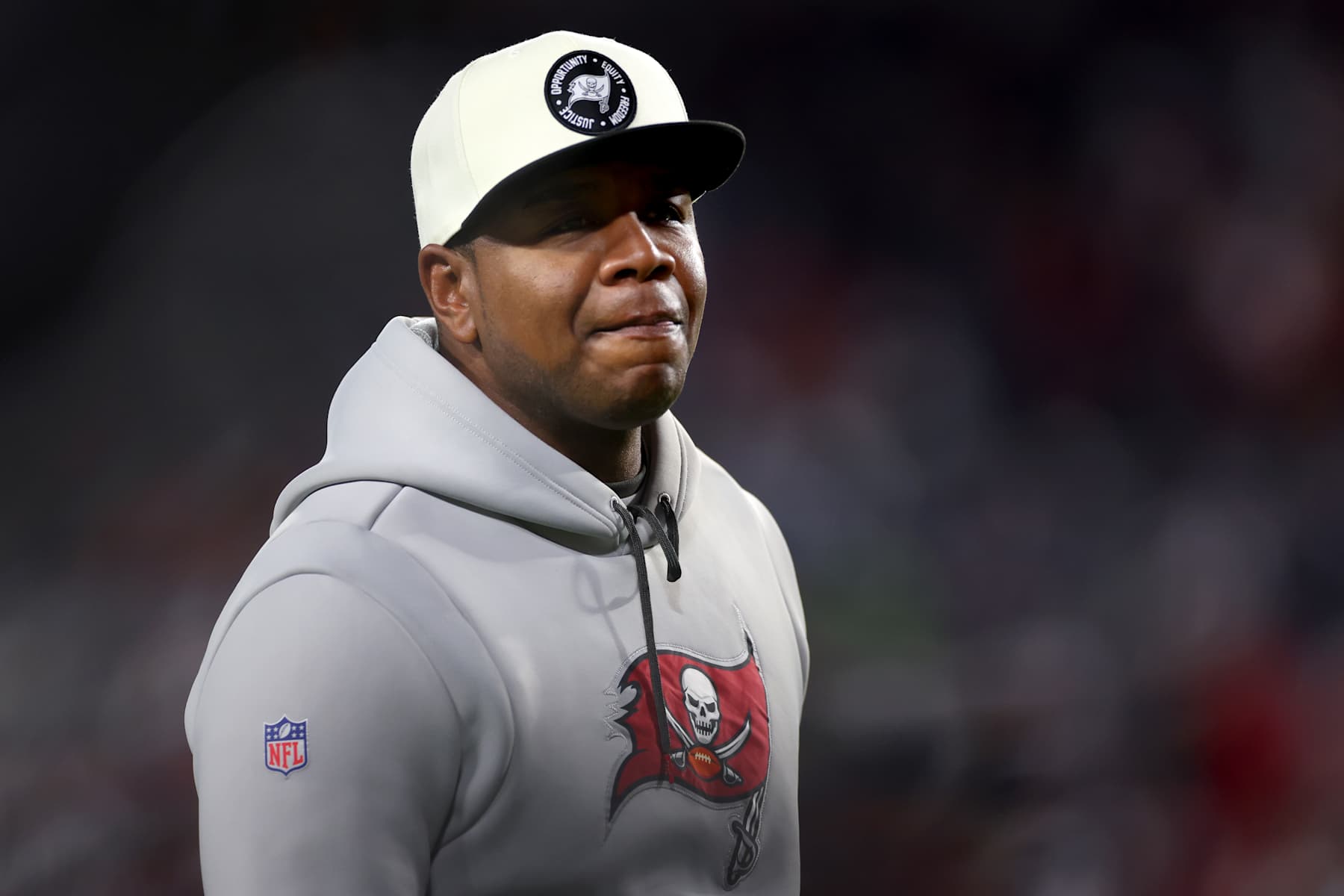 TAMPA, FLORIDA - JANUARY 16: Offensive Coordinator Byron Leftwich of the Tampa Bay Buccaneers looks on prior to the game against the Dallas Cowboys in the NFC Wild Card playoff game at Raymond James Stadium on January 16, 2023 in Tampa, Florida. (Photo by Mike Ehrmann/Getty Images)