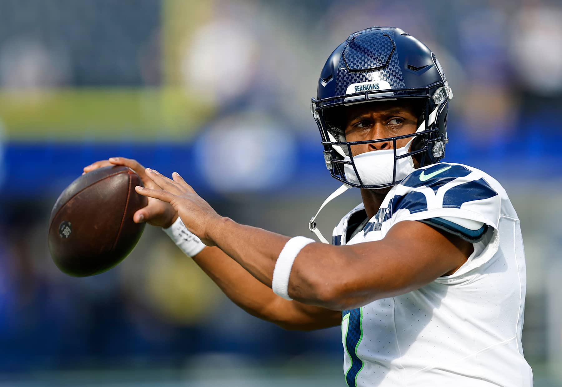 INGLEWOOD, CALIFORNIA - JANUARY 05: Geno Smith #7 of the Seattle Seahawks warms up before playing the Los Angeles Rams at SoFi Stadium on January 05, 2025 in Inglewood, California. (Photo by Ronald Martinez/Getty Images)