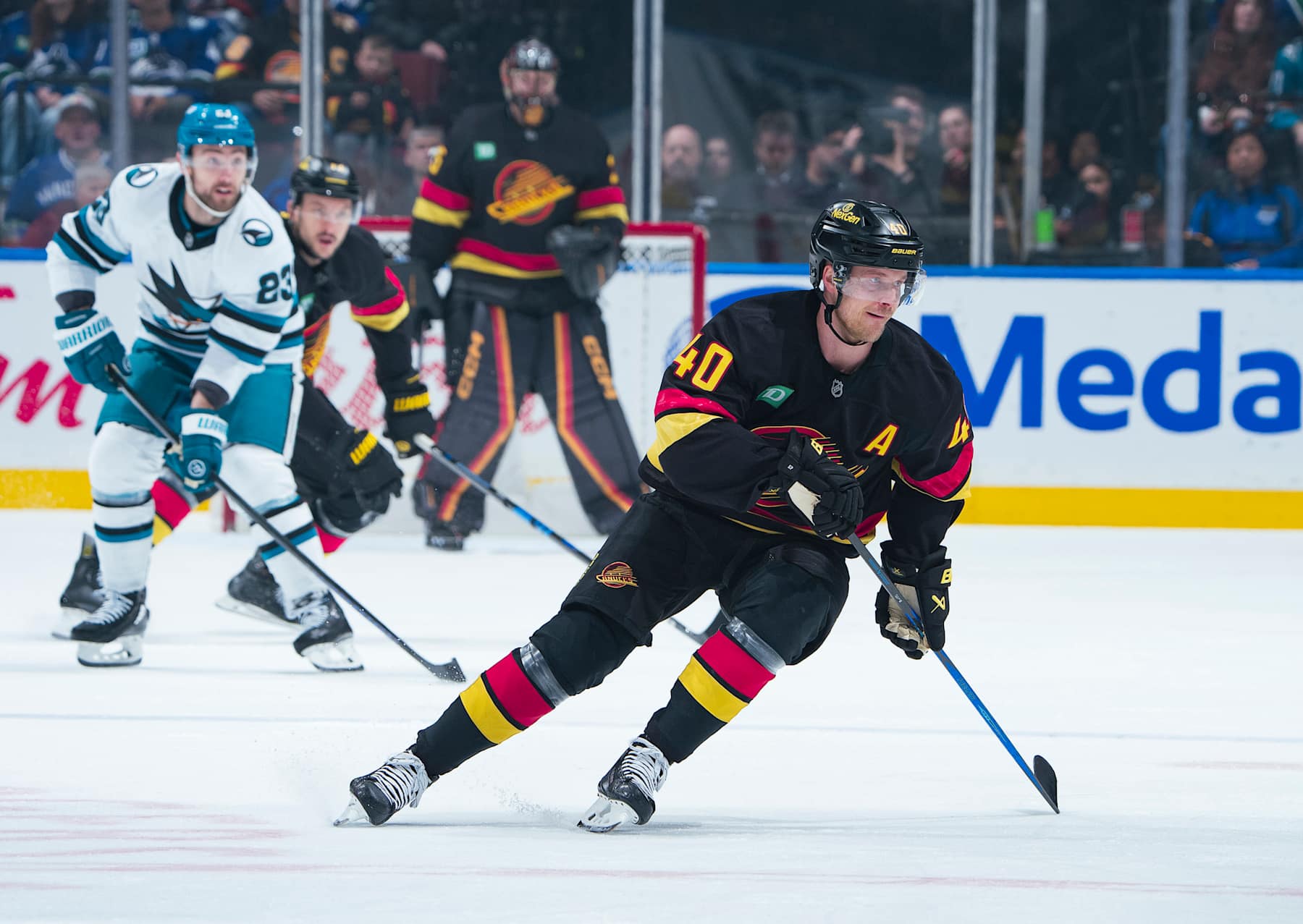 VANCOUVER, CANADA - DECEMBER 23: Elias Pettersson #40 of the Vancouver Canucks skates up ice during their NHL game against the San Jose Sharks at Rogers Arena on December 23, 2024 in Vancouver, British Columbia, Canada. (Photo by Jeff Vinnick/NHLI via Getty Images)