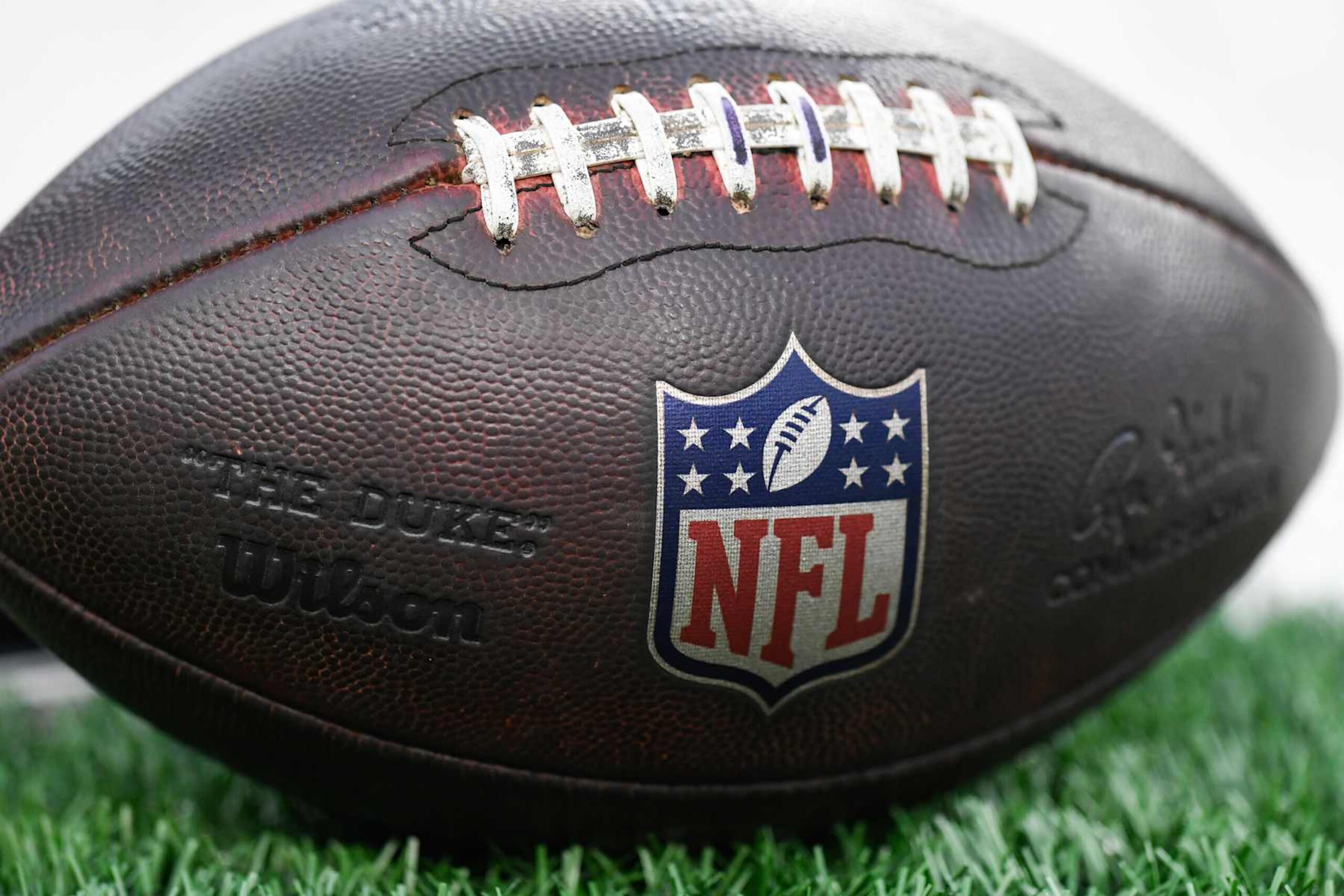 CINCINNATI, OH - DECEMBER 28: An NFL logo is seen on a football before the NFL football game between the Denver Broncos and the Cincinnati Bengals on December 28, 2024, at Paycor Stadium in Cincinnati, Ohio. (Photo by Michael Allio/Icon Sportswire via Getty Images) CINCINNATI, OH - DECEMBER 28: An NFL logo is seen on a football before the NFL football game between the Denver Broncos and the Cincinnati Bengals on December 28, 2024, at Paycor Stadium in Cincinnati, Ohio. (Photo by Michael Allio/Icon Sportswire via Getty Images)