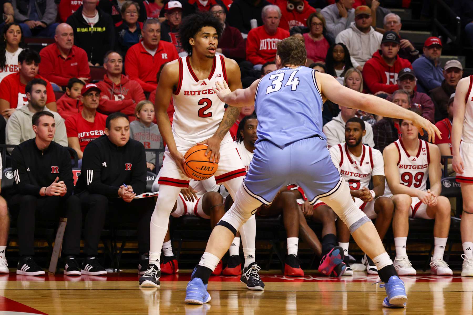 PISCATAWAY, NEW JERSEY - DECEMBER 30: Dylan Harper #2 of the Rutgers Scarlet Knights handles the ball while being defended by Jake Tavroff #34 of the Columbia Lions during the second half at Jersey Mike's Arena on December 30, 2024 in Piscataway, New Jersey. (Photo by Ed Mulholland/Getty Images)