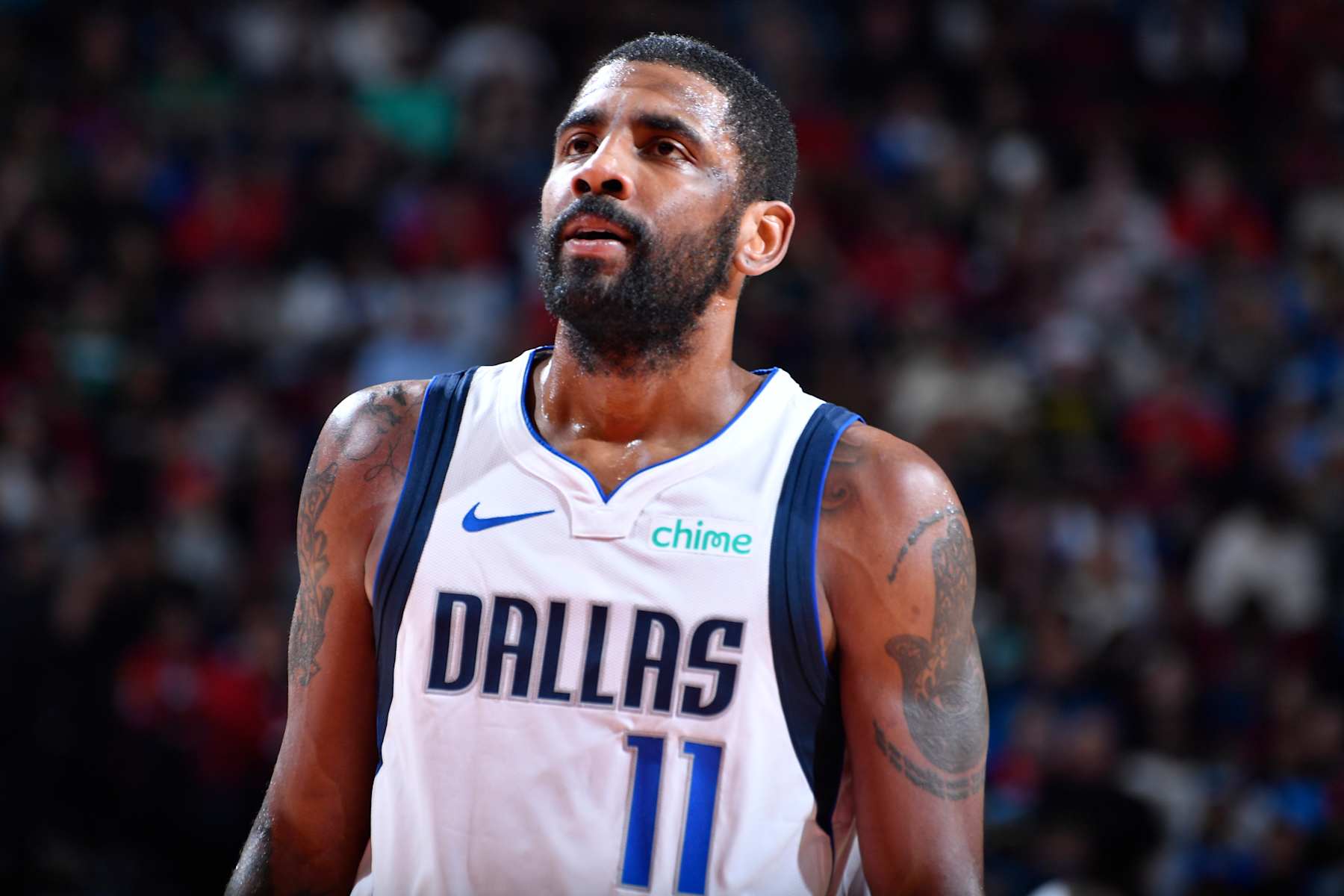 HOUSTON, TX - JANUARY 01   Kyrie Irving #11 of the Dallas Mavericks looks on during the game against the Houston Rockets on January 01, 2025 at the Toyota Center in Houston, Texas. NOTE TO USER: User expressly acknowledges and agrees that, by downloading and or using this photograph, User is consenting to the terms and conditions of the Getty Images License Agreement. Mandatory Copyright Notice: Copyright 2025 NBAE (Photo by Logan Riely/NBAE via Getty Images)