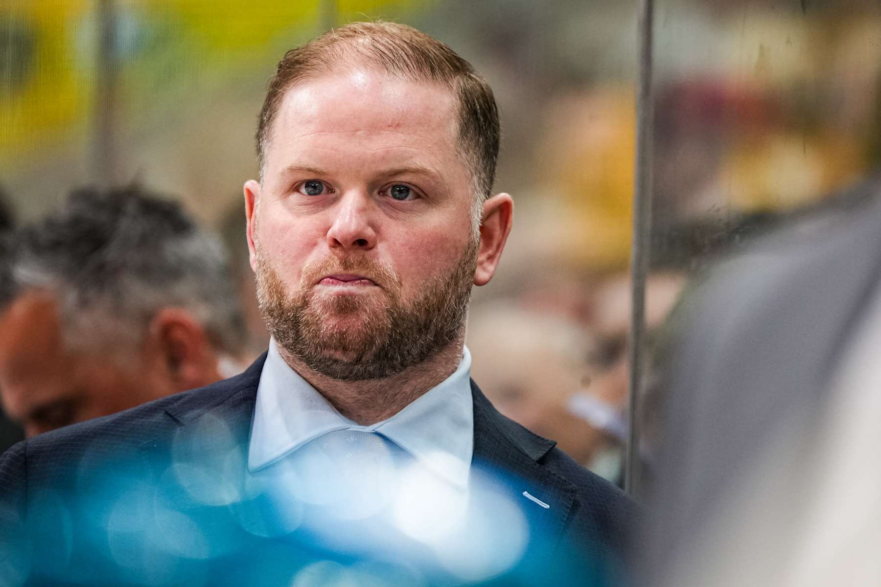 RALEIGH, NORTH CAROLINA - DECEMBER 10: Head coach Ryan Warsofsky of the San Jose Sharks looks on during the second period of the game against the Carolina Hurricanes at Lenovo Center on December 10, 2024 in Raleigh, North Carolina. (Photo by Josh Lavallee/NHLI via Getty Images)