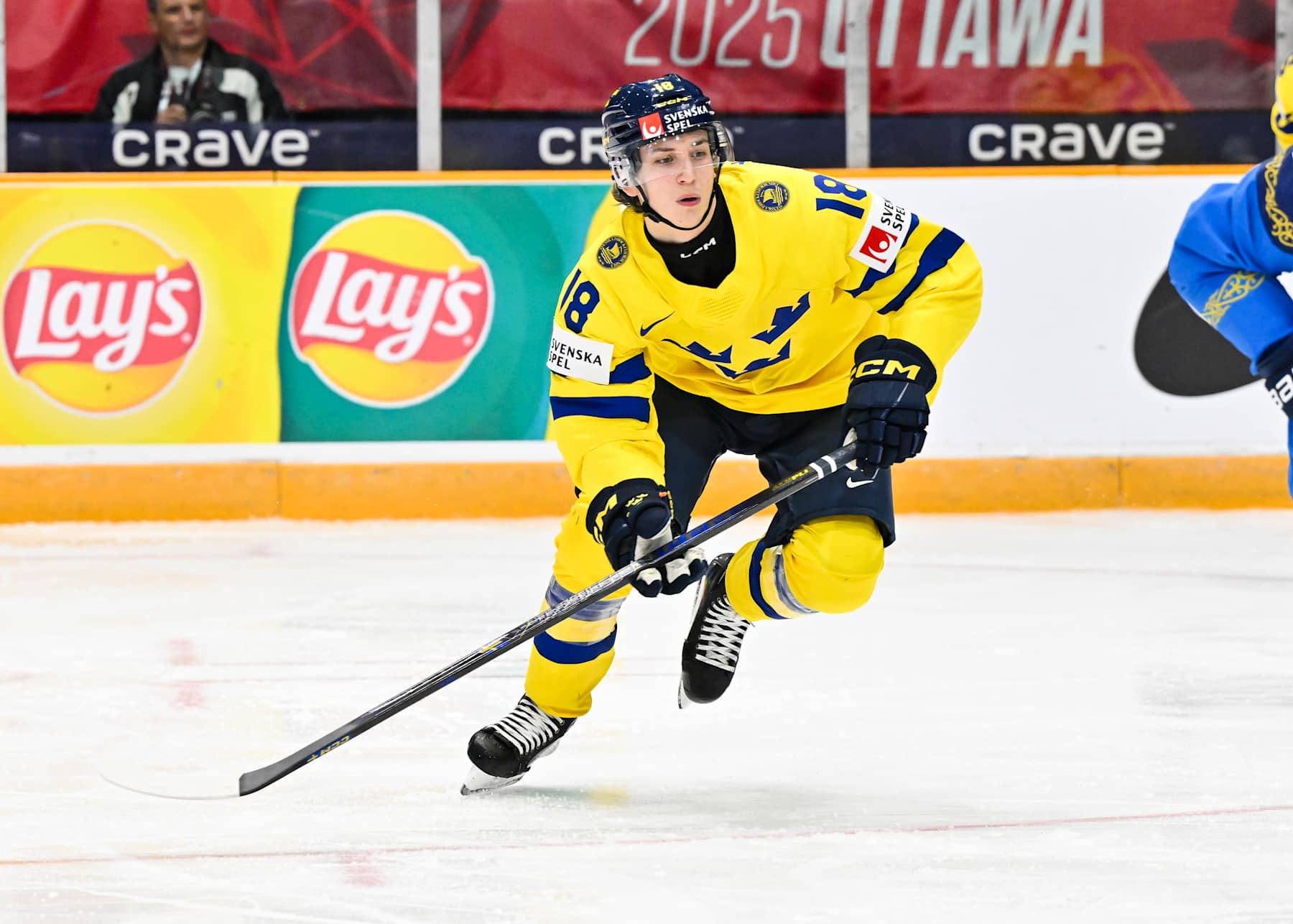 OTTAWA, CANADA - DECEMBER 27: Victor Eklund #18 of Team Sweden skates in the second period against Team Kazakhstan of the Group B match during the 2025 IIHF World Junior Championship at The Arena at TD place on December 27, 2024 in Ottawa, Ontario, Canada. Team Sweden defeated Team Kazakhstan 8-1. (Photo by Minas Panagiotakis/Getty Images)