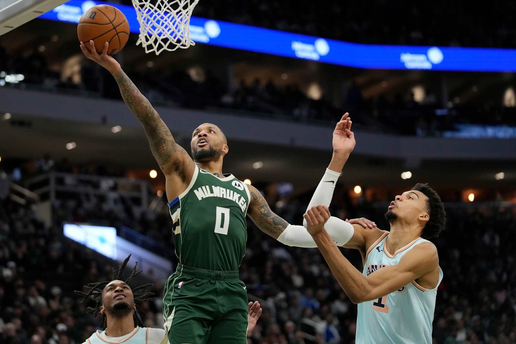 MILWAUKEE, WISCONSIN - JANUARY 08: Damian Lillard #0 of the Milwaukee Bucks shoots the ball against Victor Wembanyama #1 of the San Antonio Spurs during the second quarter at Fiserv Forum on January 08, 2025 in Milwaukee, Wisconsin. NOTE TO USER: User expressly acknowledges and agrees that, by downloading and or using this photograph, User is consenting to the terms and conditions of the Getty Images License Agreement. (Photo by Patrick McDermott/Getty Images)