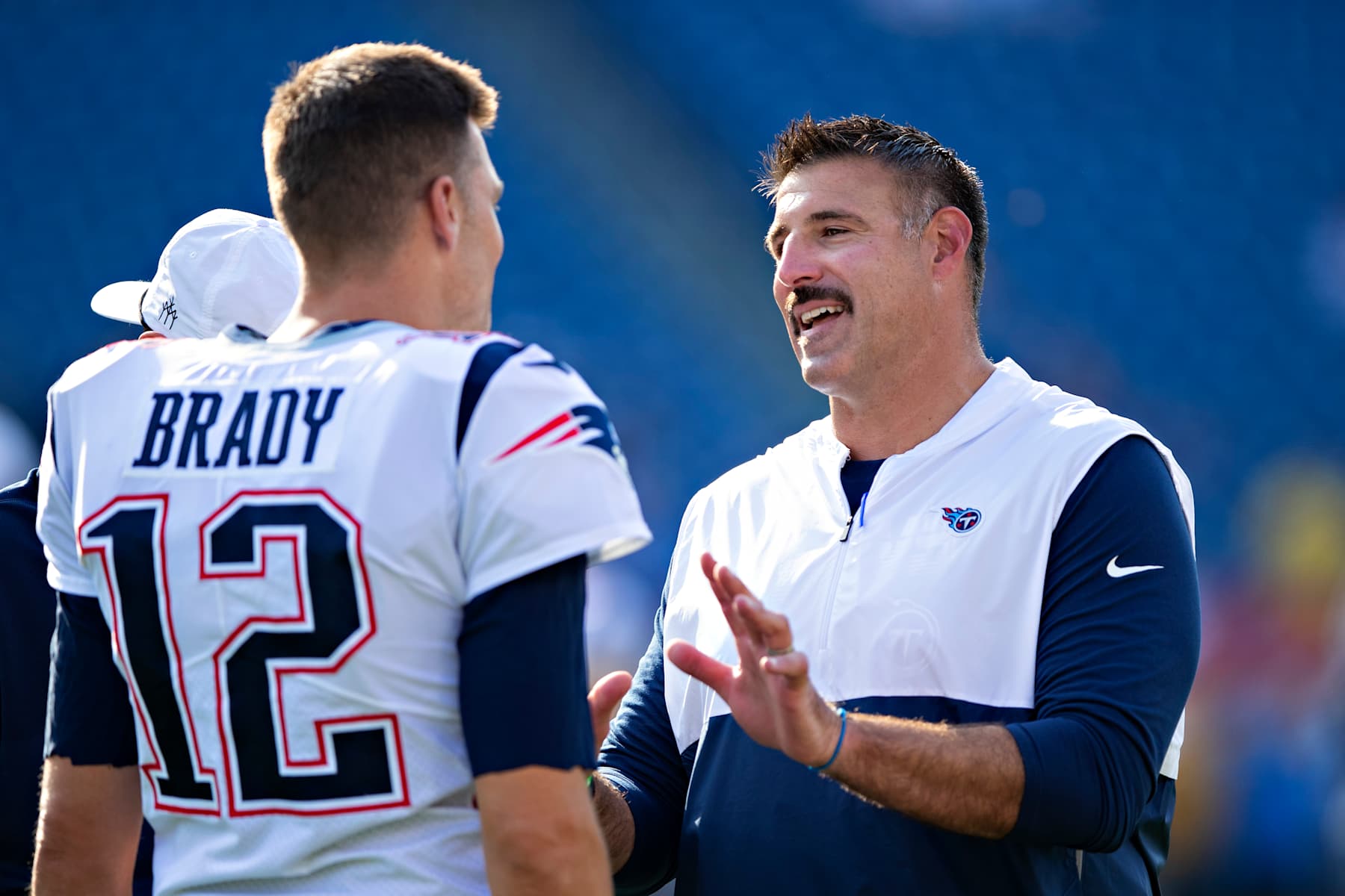 NASHVILLE, TN - AUGUST 17:  Head Coach Mike Vrabel of the Tennessee Titans talks with Tom Brady #12 of the New England Patriots before a week two preseason game at Nissan Stadium on August 17, 2019 in Nashville, Tennessee.   (Photo by Wesley Hitt/Getty Images)