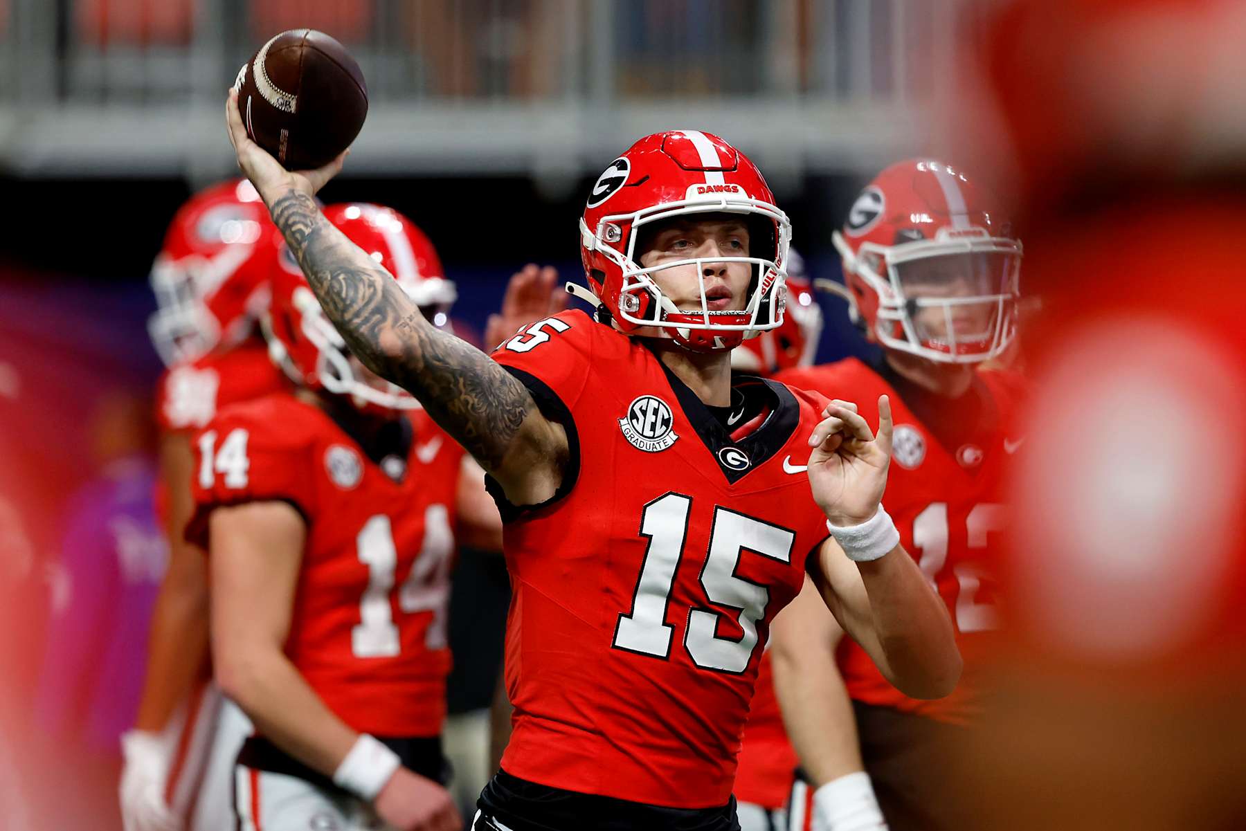 ATLANTA, GEORGIA - DECEMBER 07: Carson Beck #15 of the Georgia Bulldogs warms up prior to the 2024 SEC Championship against the Texas Longhorns at Mercedes-Benz Stadium on December 07, 2024 in Atlanta, Georgia. (Photo by Butch Dill/Getty Images)