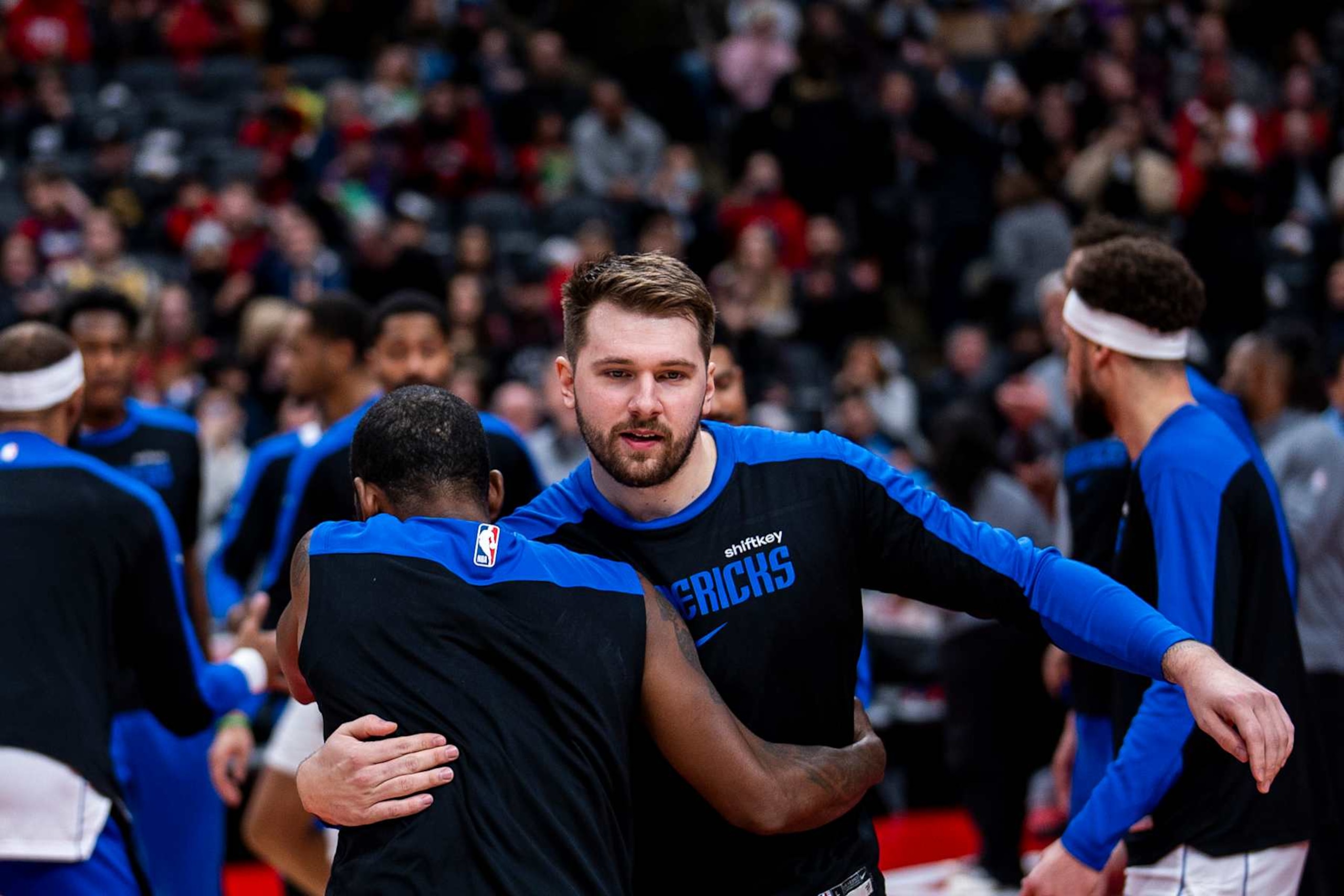 TORONTO, ON - DECEMBER 7: Luka Doncic #77 of the Dallas Mavericks hugs teammate Kyrie Irving #11 before facing the Toronto Raptors at Scotiabank Arena on December 7, 2024 in Toronto, Ontario, Canada. NOTE TO USER: User expressly acknowledges and agrees that, by downloading and/or using this Photograph, user is consenting to the terms and conditions of the Getty Images License Agreement. (Photo by Andrew Lahodynskyj/Getty Images) TORONTO, ON - DECEMBER 7: Luka Doncic #77 of the Dallas Mavericks hugs teammate Kyrie Irving #11 before facing the Toronto Raptors at Scotiabank Arena on December 7, 2024 in Toronto, Ontario, Canada. NOTE TO USER: User expressly acknowledges and agrees that, by downloading and/or using this Photograph, user is consenting to the terms and conditions of the Getty Images License Agreement. (Photo by Andrew Lahodynskyj/Getty Images)