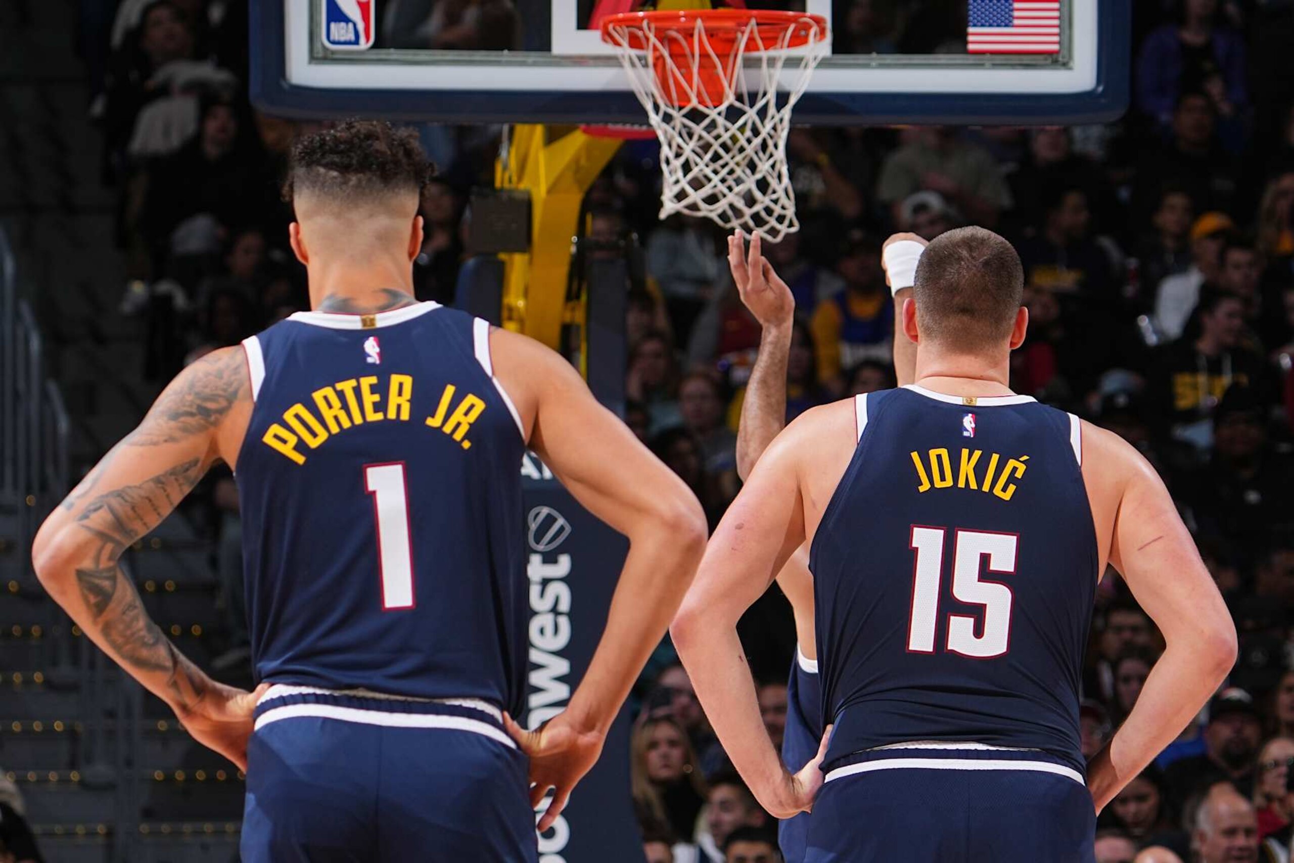 DENVER, CO - DECEMBER 13: Michael Porter Jr. #1 and Nikola Jokic #15 of the Denver Nuggets look on during the game against the LA Clippers on December 13, 2024 at Ball Arena in Denver, Colorado. NOTE TO USER: User expressly acknowledges and agrees that, by downloading and/or using this Photograph, user is consenting to the terms and conditions of the Getty Images License Agreement. Mandatory Copyright Notice: Copyright 2024 NBAE (Photo by Bart Young/NBAE via Getty Images) DENVER, CO - DECEMBER 13: Michael Porter Jr. #1 and Nikola Jokic #15 of the Denver Nuggets look on during the game against the LA Clippers on December 13, 2024 at Ball Arena in Denver, Colorado. NOTE TO USER: User expressly acknowledges and agrees that, by downloading and/or using this Photograph, user is consenting to the terms and conditions of the Getty Images License Agreement. Mandatory Copyright Notice: Copyright 2024 NBAE (Photo by Bart Young/NBAE via Getty Images)