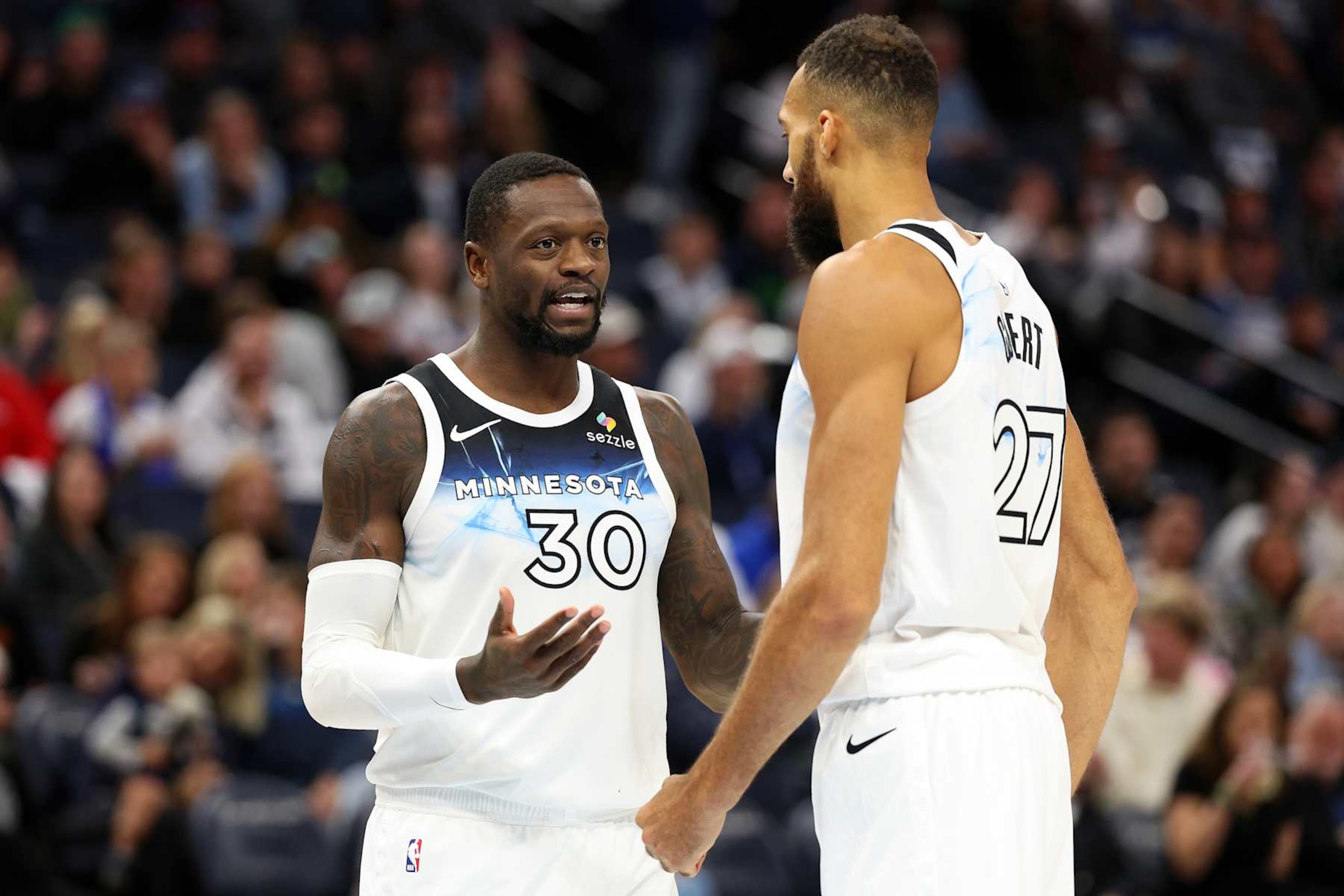 MINNEAPOLIS, MINNESOTA - NOVEMBER 17: Julius Randle #30 of the Minnesota Timberwolves interacts with Rudy Gobert #27 in the third quarter against the Phoenix Suns at Target Center on November 17, 2024 in Minneapolis, Minnesota. The Timberwolves defeated the Suns 120-117. NOTE TO USER: User expressly acknowledges and agrees that, by downloading and or using this photograph, User is consenting to the terms and conditions of the Getty Images License Agreement. (Photo by David Berding/Getty Images) MINNEAPOLIS, MINNESOTA - NOVEMBER 17: Julius Randle #30 of the Minnesota Timberwolves interacts with Rudy Gobert #27 in the third quarter against the Phoenix Suns at Target Center on November 17, 2024 in Minneapolis, Minnesota. The Timberwolves defeated the Suns 120-117. NOTE TO USER: User expressly acknowledges and agrees that, by downloading and or using this photograph, User is consenting to the terms and conditions of the Getty Images License Agreement. (Photo by David Berding/Getty Images)