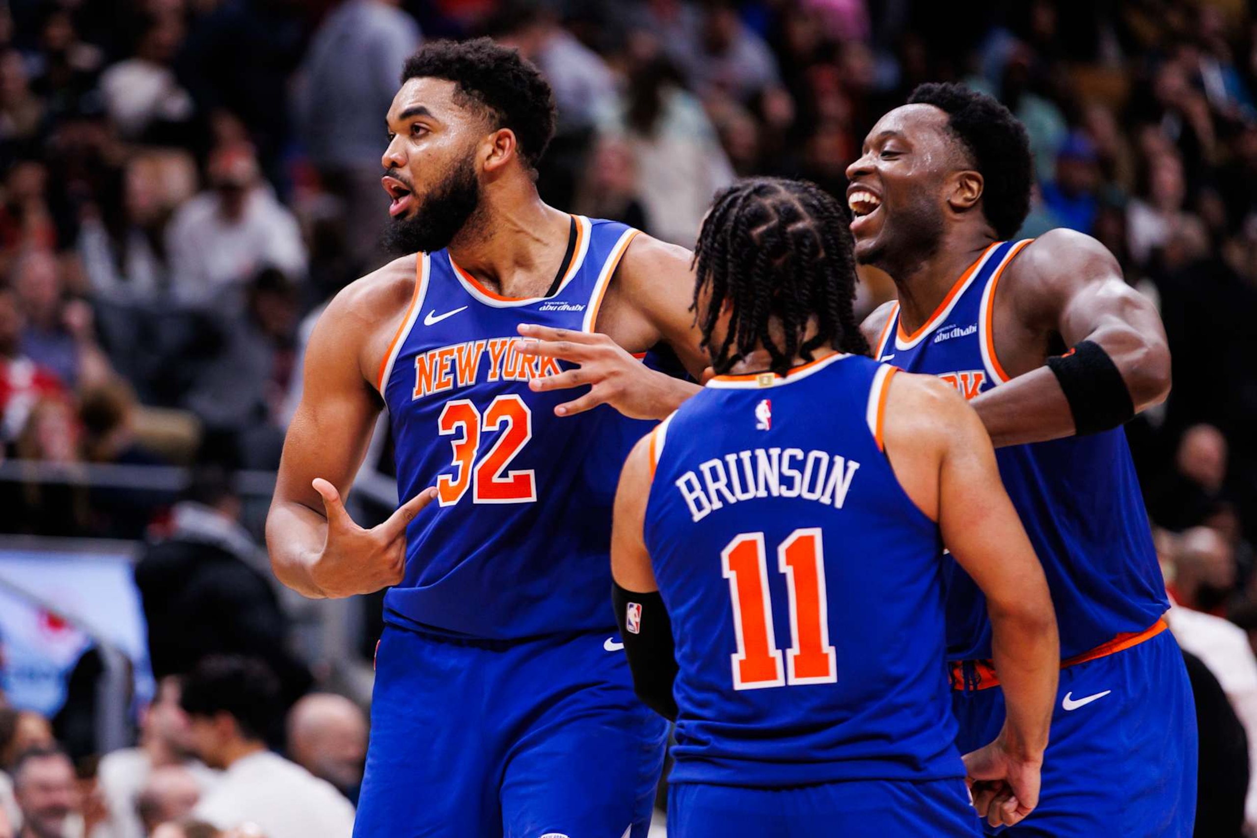 TORONTO, CANADA - DECEMBER 9: Karl-Anthony Towns #32 of the New York Knicks points to his jersey as he celebrates a basket with Jalen Brunson #11 and OG Anunoby #8 during second half of their NBA game against the Toronto Raptors at Scotiabank Arena on December 9, 2024 in Toronto, Canada. NOTE TO USER: User expressly acknowledges and agrees that, by downloading and or using this photograph, User is consenting to the terms and conditions of the Getty Images License Agreement. (Photo by Cole Burston/Getty Images) TORONTO, CANADA - DECEMBER 9: Karl-Anthony Towns #32 of the New York Knicks points to his jersey as he celebrates a basket with Jalen Brunson #11 and OG Anunoby #8 during second half of their NBA game against the Toronto Raptors at Scotiabank Arena on December 9, 2024 in Toronto, Canada. NOTE TO USER: User expressly acknowledges and agrees that, by downloading and or using this photograph, User is consenting to the terms and conditions of the Getty Images License Agreement. (Photo by Cole Burston/Getty Images)