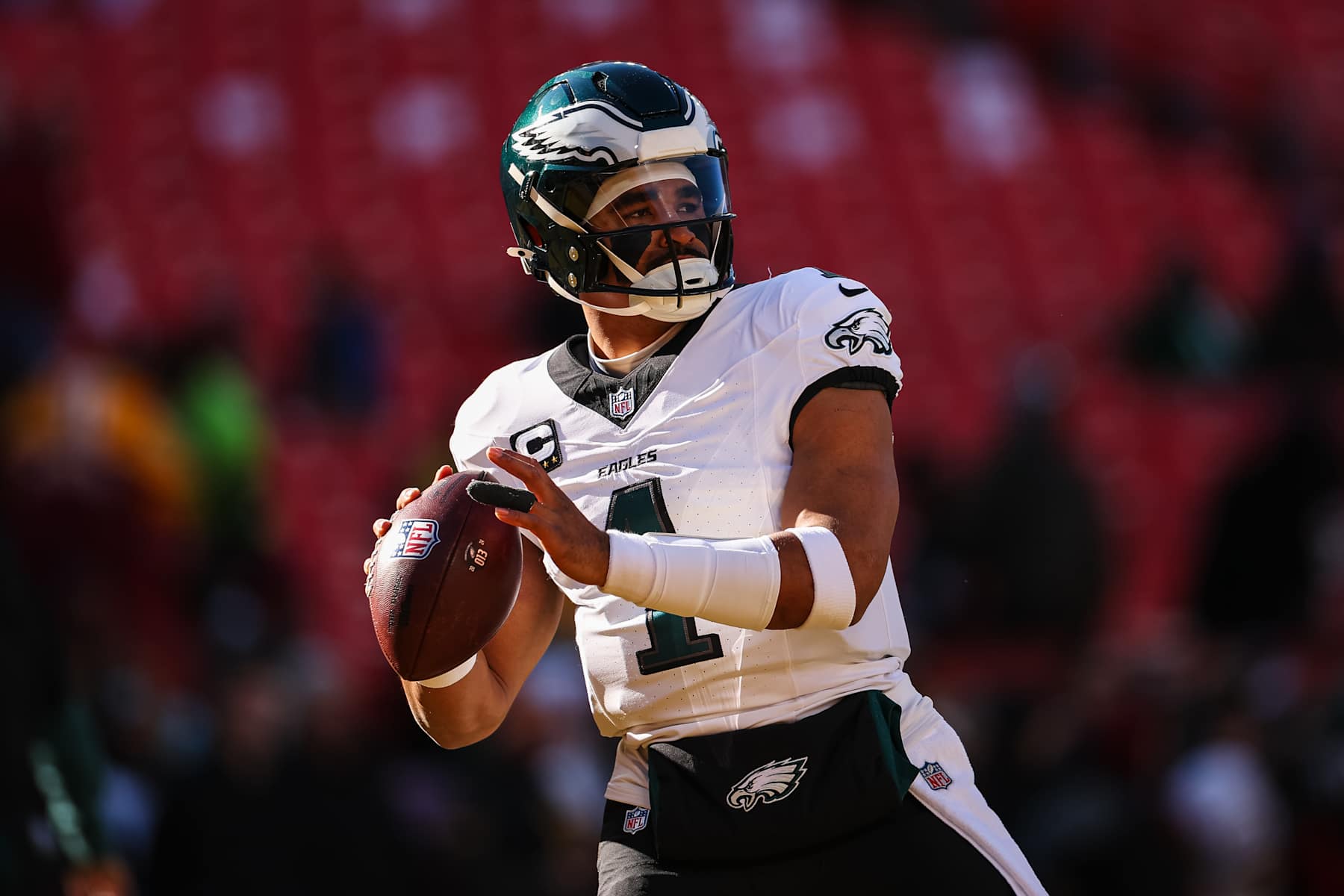 LANDOVER, MD - DECEMBER 22: Jalen Hurts #1 of the Philadelphia Eagles attempts a pass before the game against the Washington Commanders at Northwest Stadium on December 22, 2024 in Landover, Maryland. (Photo by Scott Taetsch/Getty Images)