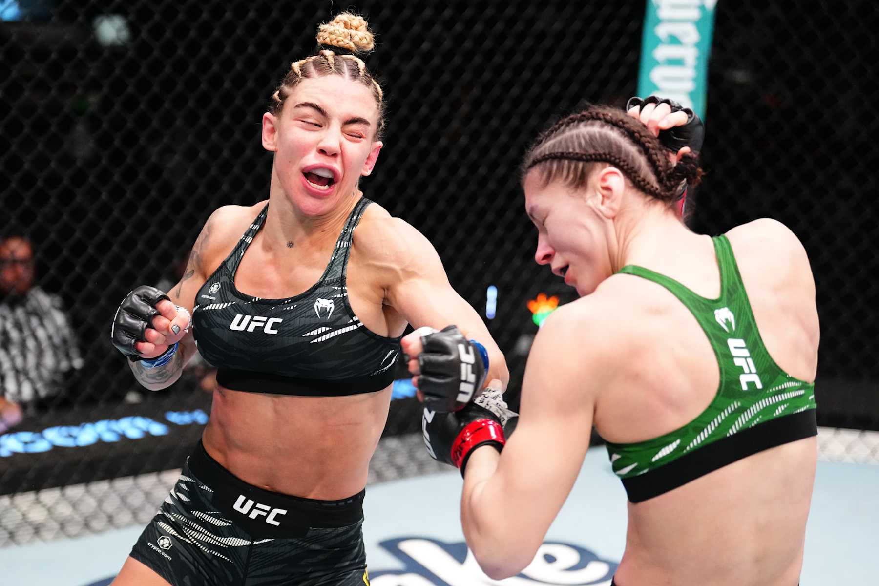 LAS VEGAS, NEVADA - JANUARY 11: (L-R) Nicolle Caliari of Brazil punches Ernesta Kareckaite of Lithuania in a flyweight fight during the UFC Fight Night event at UFC APEX on January 11, 2025 in Las Vegas, Nevada. (Photo by Chris Unger/Zuffa LLC via Getty Images)