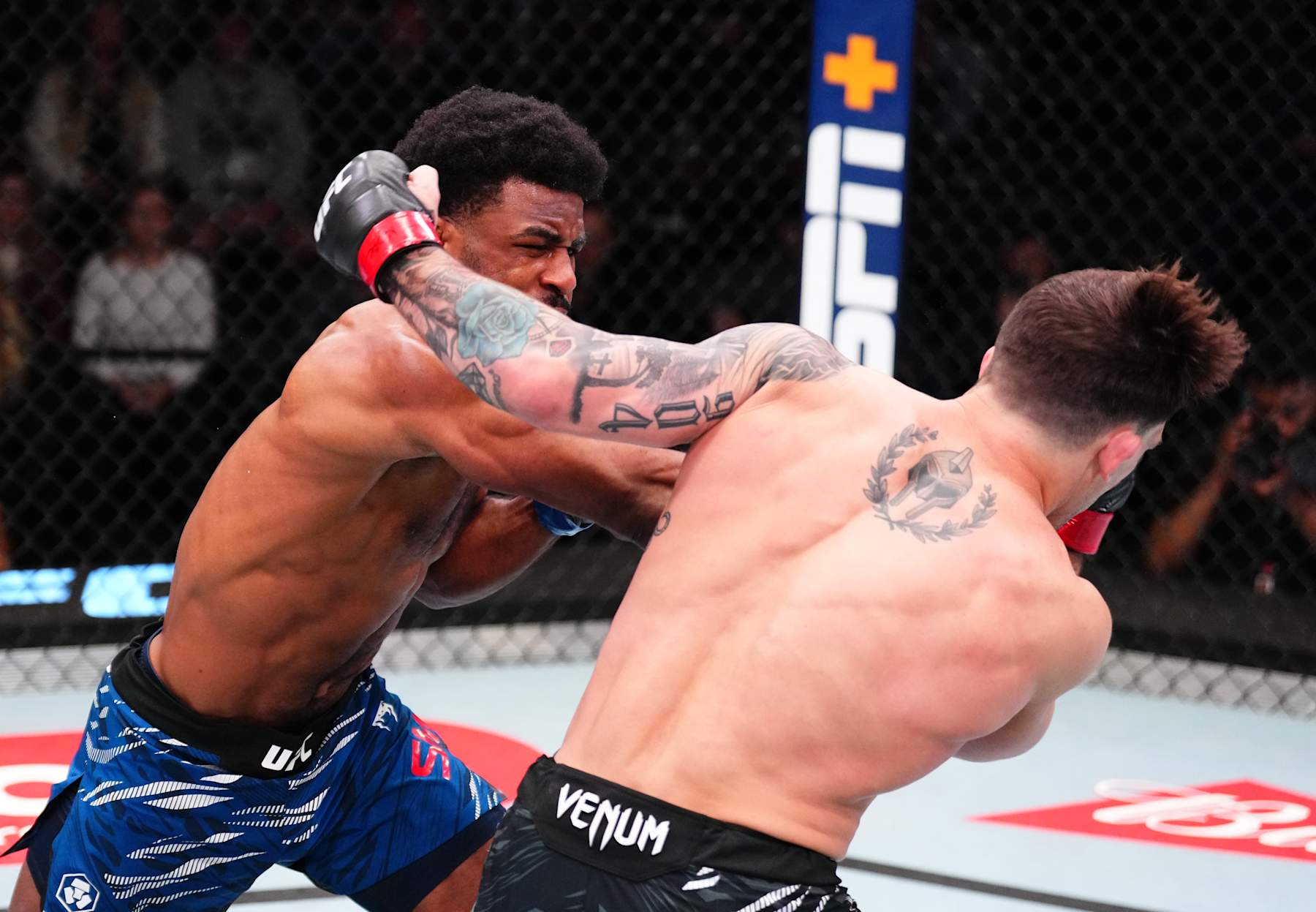 LAS VEGAS, NEVADA - JANUARY 11: (L-R) Jacobe Smith punches Preston Parsons in a welterweight fight during the UFC Fight Night event at UFC APEX on January 11, 2025 in Las Vegas, Nevada. (Photo by Chris Unger/Zuffa LLC via Getty Images)