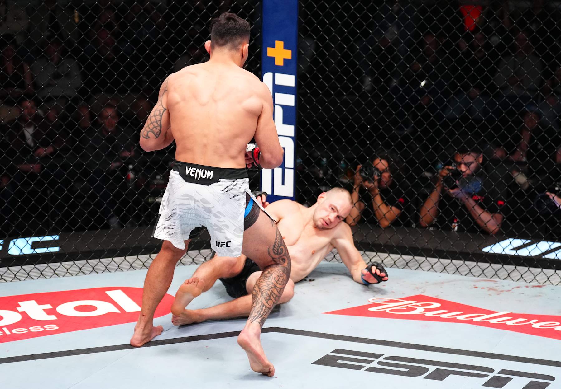 LAS VEGAS, NEVADA - JANUARY 11: (L-R) Punahele Soriano knocks down Uros Medic of Serbia in a welterweight fight during the UFC Fight Night event at UFC APEX on January 11, 2025 in Las Vegas, Nevada. (Photo by Chris Unger/Zuffa LLC via Getty Images)
