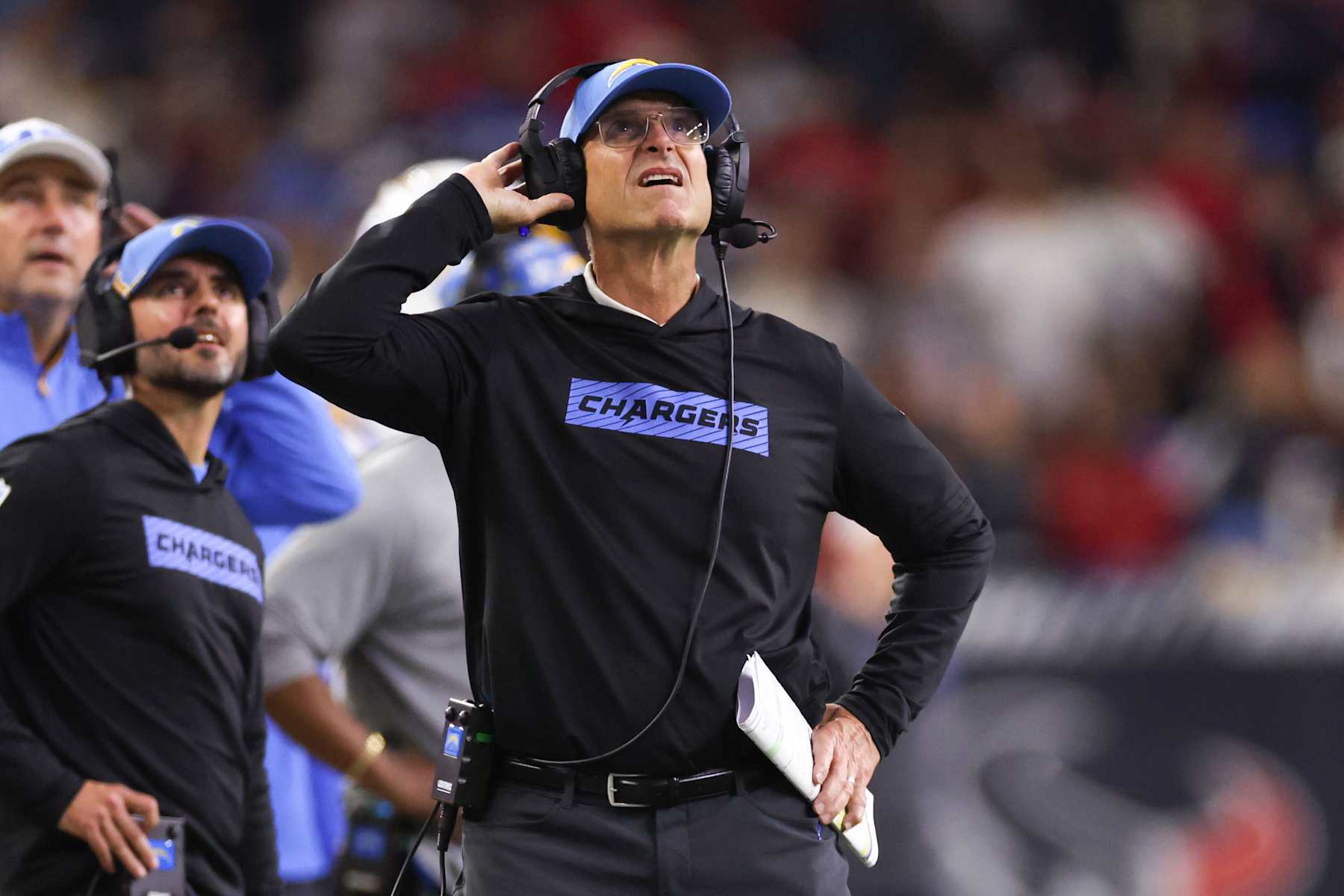 HOUSTON, TEXAS - JANUARY 11: Head coach Jim Harbaugh of the Los Angeles Chargers reacts in the fourth quarter of the game against the Houston Texans during the AFC Wild Card Playoffs at NRG Stadium on January 11, 2025 in Houston, Texas. (Photo by Tim Warner/Getty Images)