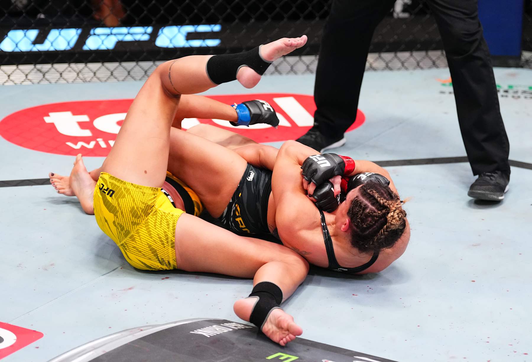 LAS VEGAS, NEVADA - JANUARY 11: (R-L) Mackenzie Dern secures an arm bar submission against Amanda Ribas of Brazil in a strawweight fight during the UFC Fight Night event at UFC APEX on January 11, 2025 in Las Vegas, Nevada. (Photo by Chris Unger/Zuffa LLC via Getty Images)
