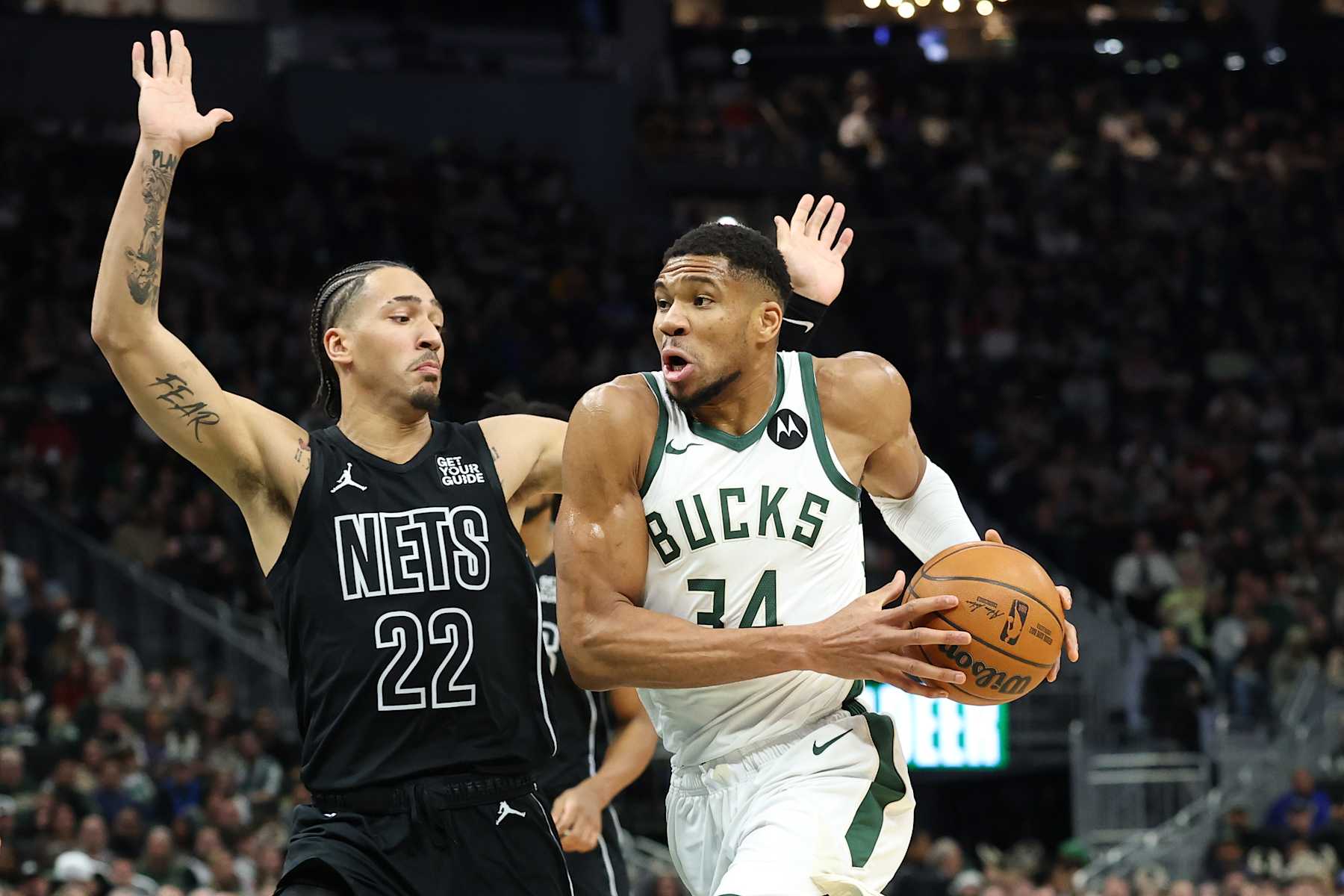 MILWAUKEE, WISCONSIN - JANUARY 02: Giannis Antetokounmpo #34 of the Milwaukee Bucks drives around Jalen Wilson #22 of the Brooklyn Nets during a game at Fiserv Forum on January 02, 2025 in Milwaukee, Wisconsin. The Nets defeated the Bucks 113-110. NOTE TO USER: User expressly acknowledges and agrees that, by downloading and or using this photograph, User is consenting to the terms and conditions of the Getty Images License Agreement. (Photo by Stacy Revere/Getty Images)