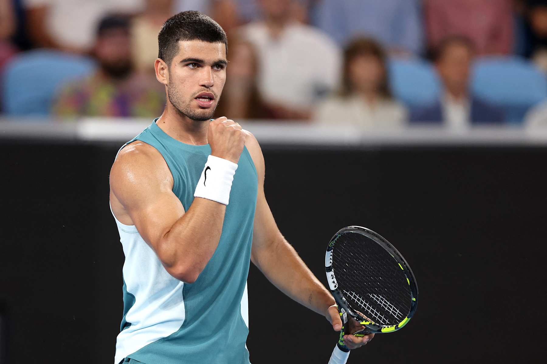 Spain's Carlos Alcaraz celebrates the match point against Kazakhstan's Alexander Shevchenko during their men's singles match on day two of the Australian Open tennis tournament in Melbourne on January 13, 2025. (Photo by Martin KEEP / AFP) / -- IMAGE RESTRICTED TO EDITORIAL USE - STRICTLY NO COMMERCIAL USE -- (Photo by MARTIN KEEP/AFP via Getty Images)