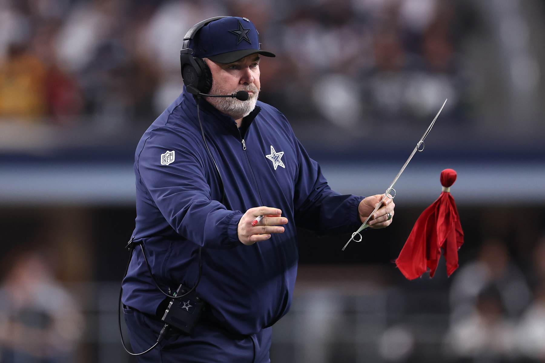 ARLINGTON, TEXAS - JANUARY 05: Dallas Cowboys head coach Mike McCarthy throws a challenge flag during the fourth quarter against the Washington Commanders at AT&T Stadium on January 05, 2025 in Arlington, Texas. (Photo by Sam Hodde/Getty Images)