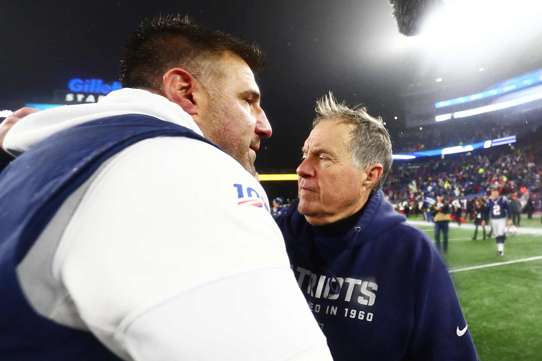 FOXBOROUGH, MASSACHUSETTS - JANUARY 04: Head coach Mike Vrabel of the Tennessee Titans is congratulated by head coach Bill Belichick of the New England Patriots  after their 20-13 win in the AFC Wild Card Playoff game at Gillette Stadium on January 04, 2020 in Foxborough, Massachusetts. (Photo by Adam Glanzman/Getty Images)