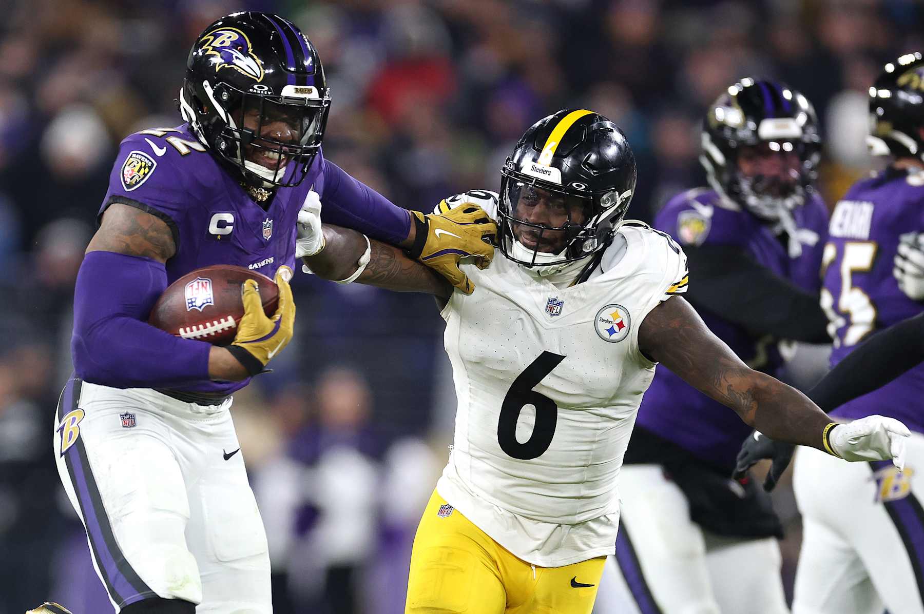 BALTIMORE, MARYLAND - JANUARY 11: Derrick Henry #22 of the Baltimore Ravens runs the ball for a touchdown against Patrick Queen #6 of the Pittsburgh Steelers during the third quarter during the AFC Wild Card Playoff at M&T Bank Stadium on January 11, 2025 in Baltimore, Maryland.  (Photo by Al Bello/Getty Images)