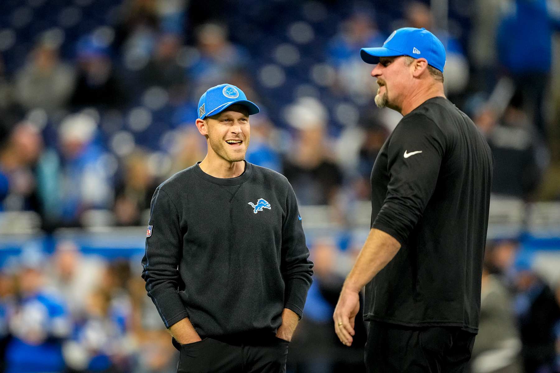 DETROIT, MICHIGAN - DECEMBER 05: Offensive coordinator Ben Johnson and head coach Dan Campbell of the Detroit Lions talk prior to a game against the Green Bay Packers at Ford Field on December 05, 2024 in Detroit, Michigan. (Photo by Nic Antaya/Getty Images)