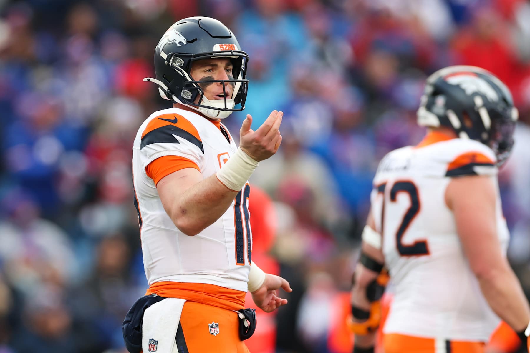 ORCHARD PARK, NEW YORK - JANUARY 12: Bo Nix #10 of the Denver Broncos looks on against the Buffalo Bills in the fourth quarter during the AFC Wild Card Playoffs at Highmark Stadium on January 12, 2025 in Orchard Park, New York. (Photo by Elsa/Getty Images)
