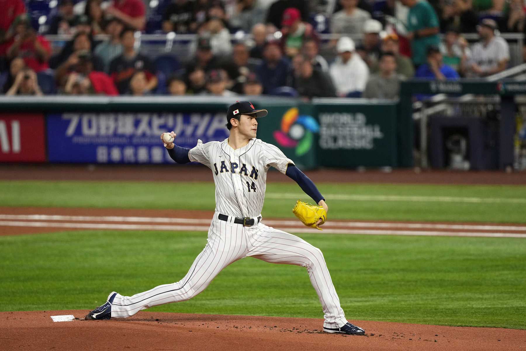 MIAMI, FL - MARCH 20: Roki Sasaki #14 of Japan delivers a pitch in the first inning against Mexico at loanDepot park on March 20, 2023 in Miami, Florida. (Photo by Jasen Vinlove/Miami Marlins/Getty Images)