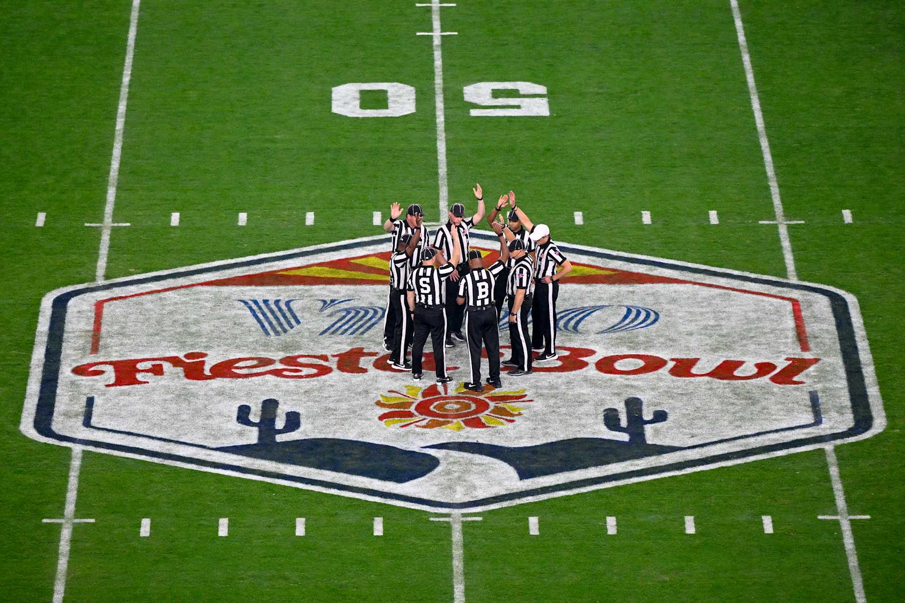 GLENDALE, ARIZONA - DECEMBER 31: A view of the referee officiating crew before the game between the Penn State Nittany Lions and the Boise State Broncos in the Fiesta Bowl in the CFP Quarterfinal at State Farm Stadium on December 31, 2024 in Glendale, Arizona. (Photo by CFP/Getty Images)