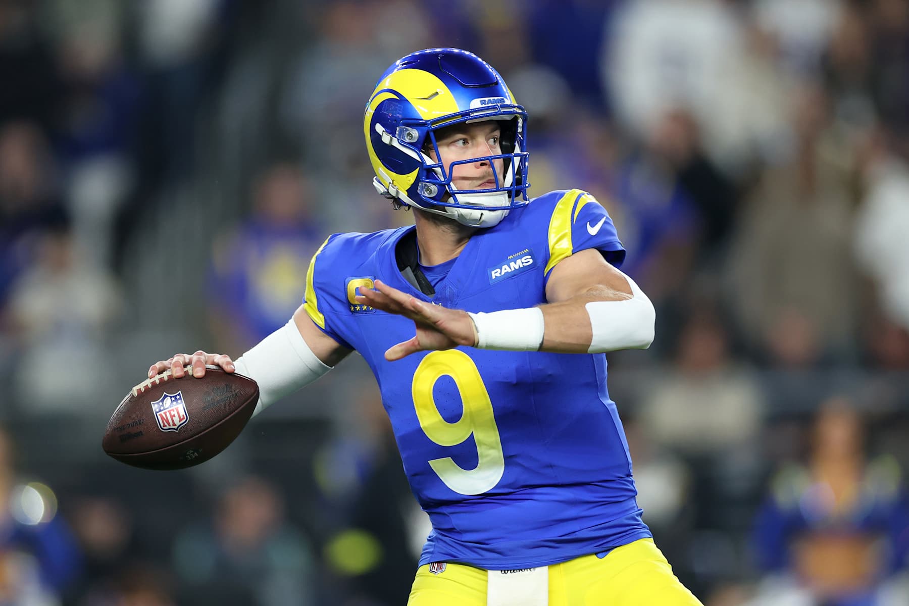 GLENDALE, ARIZONA - JANUARY 13: Matthew Stafford #9 of the Los Angeles Rams throws a pass during the first quarter against the Minnesota Vikings during the NFC Wild Card Playoff at State Farm Stadium on January 13, 2025 in Glendale, Arizona.  (Photo by Christian Petersen/Getty Images)